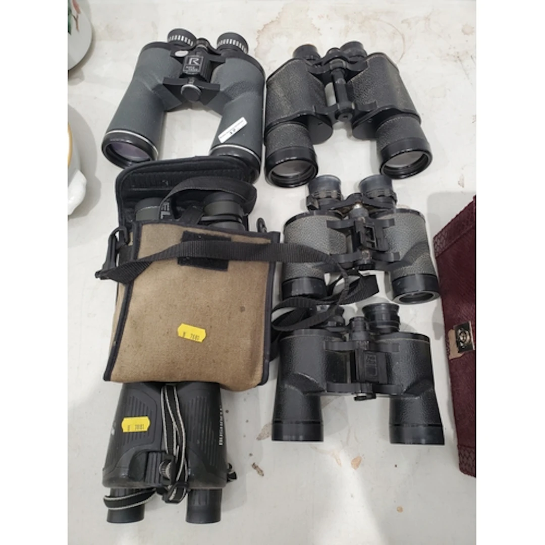 A pair of Bushnell 8x30 Binoculars, pair of 10x42 Binoculars...