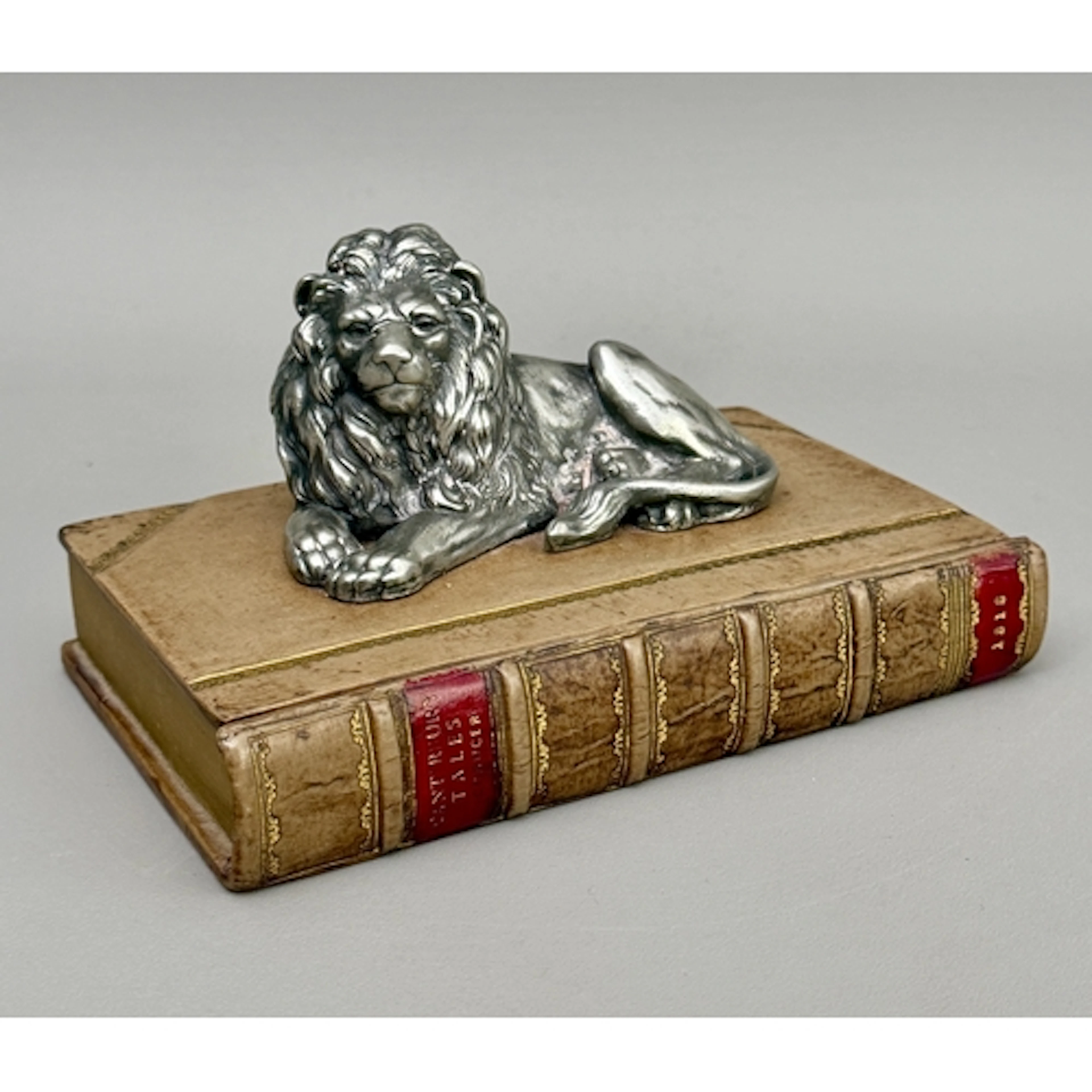 An antique-style playing card box - in the form of a leather...
