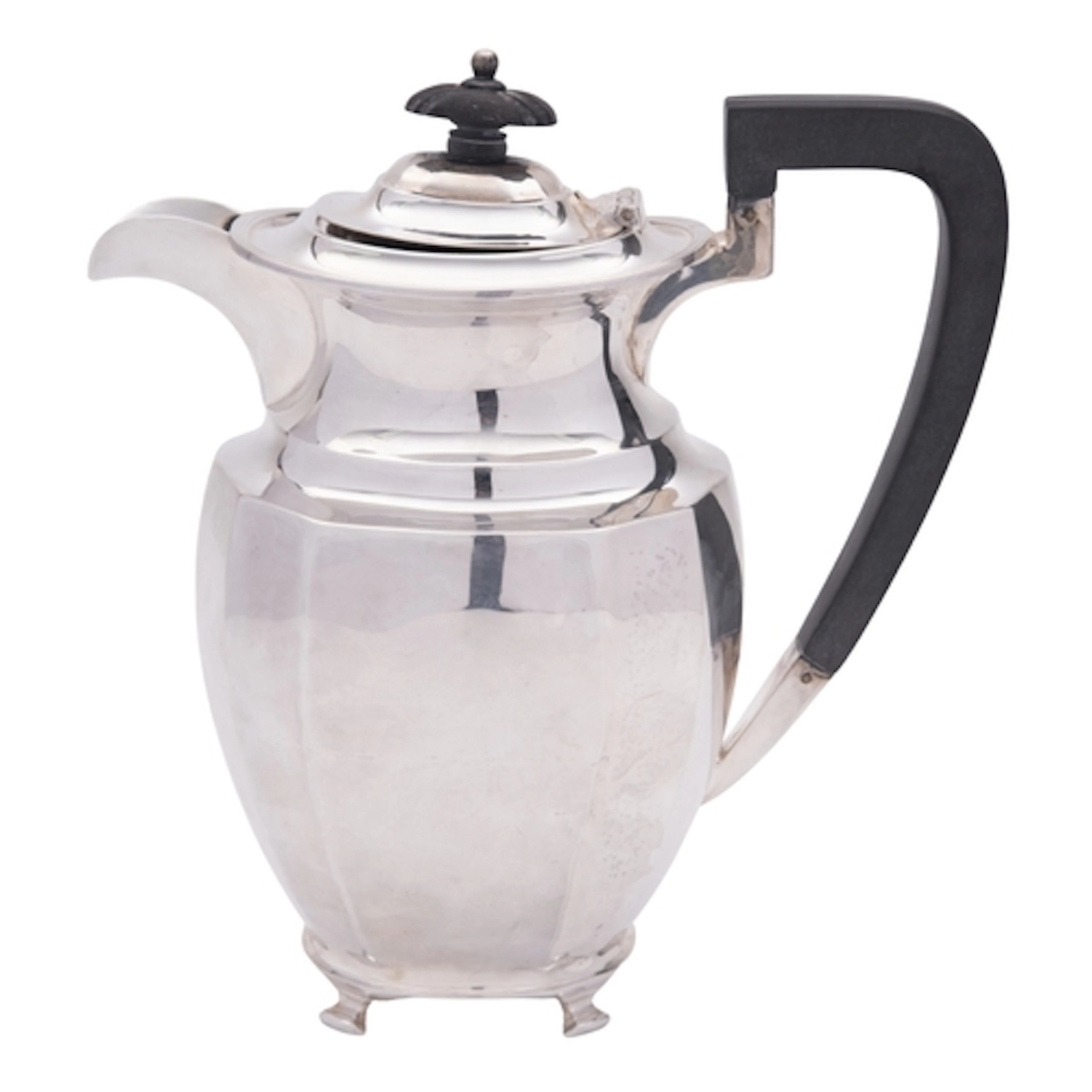 A George V silver hot water jug, shaped oblong, with a reede...