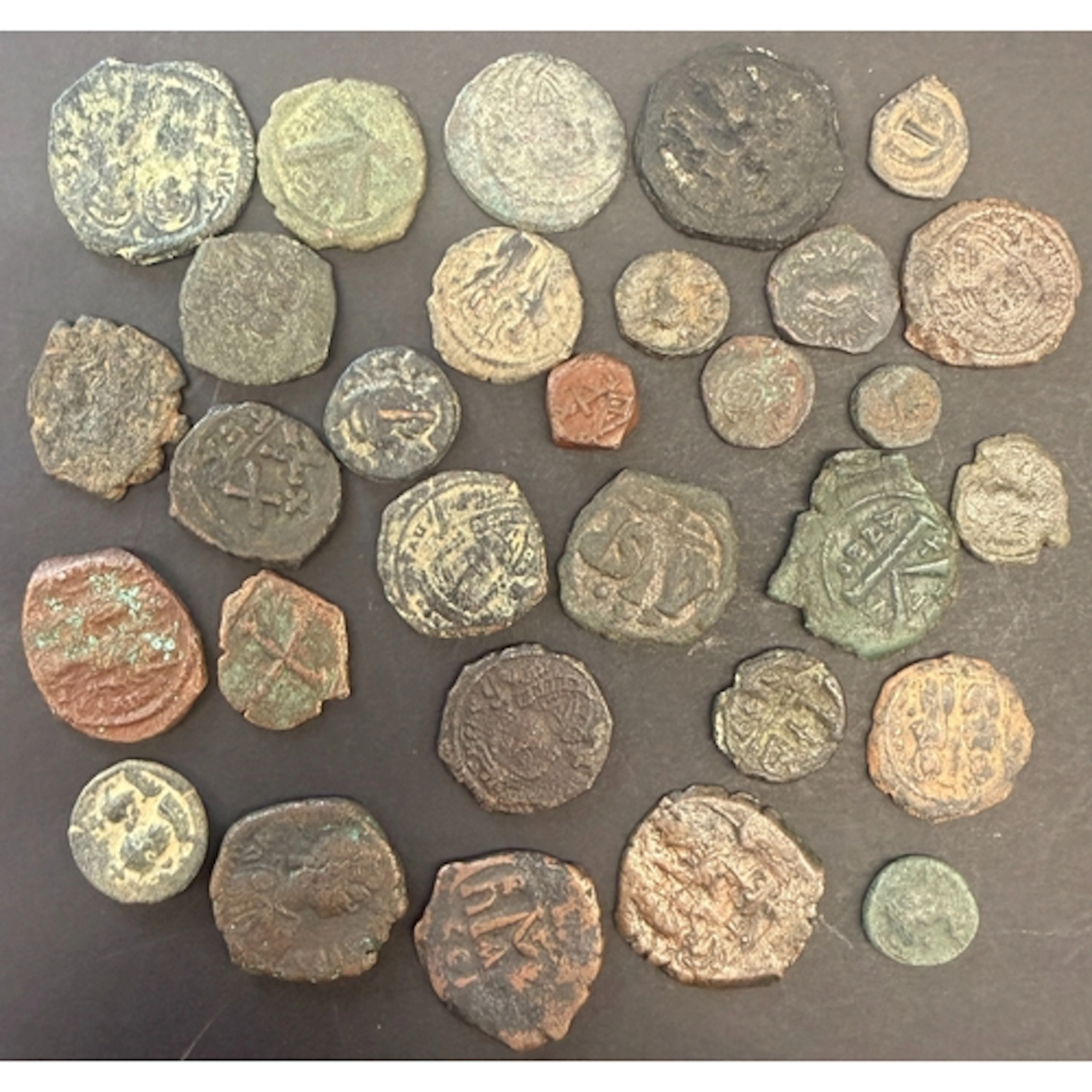 A group of thirty early Byzantine bronze coins, including is...