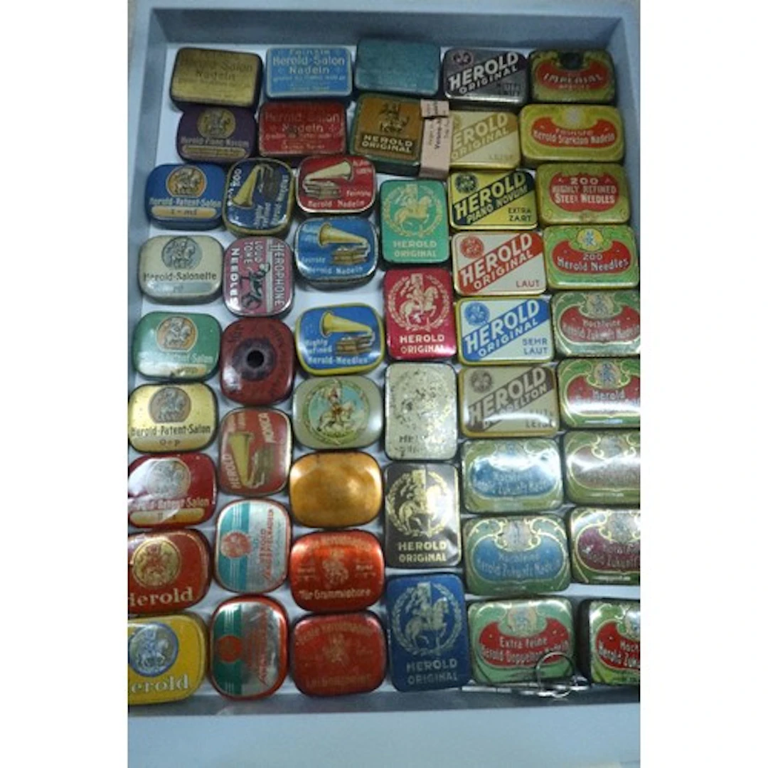 A tray of vintage gramophone needle tins