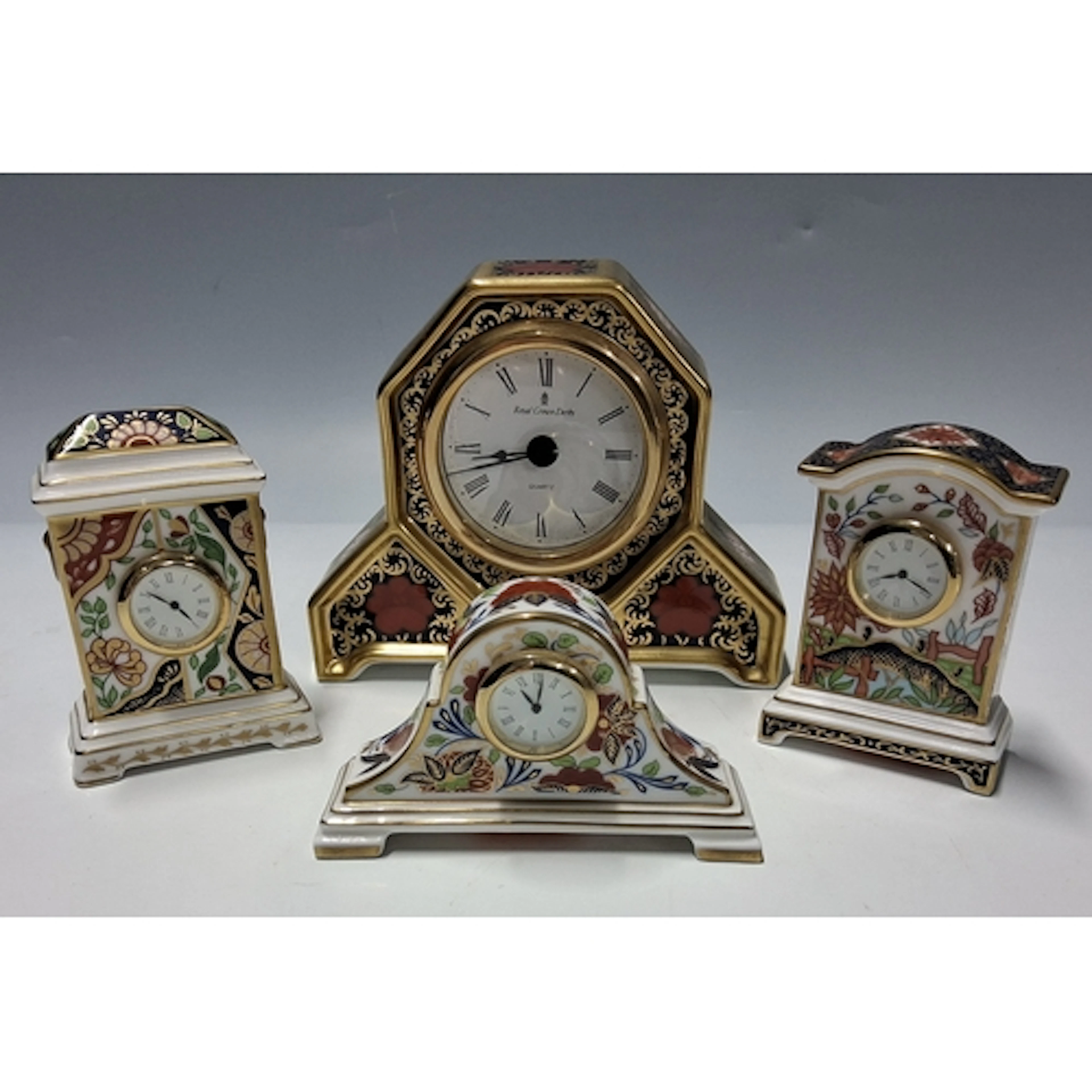 A GROUP OF ROYAL CROWN DERBY CLOCKS, comprising a 'Old Imari...