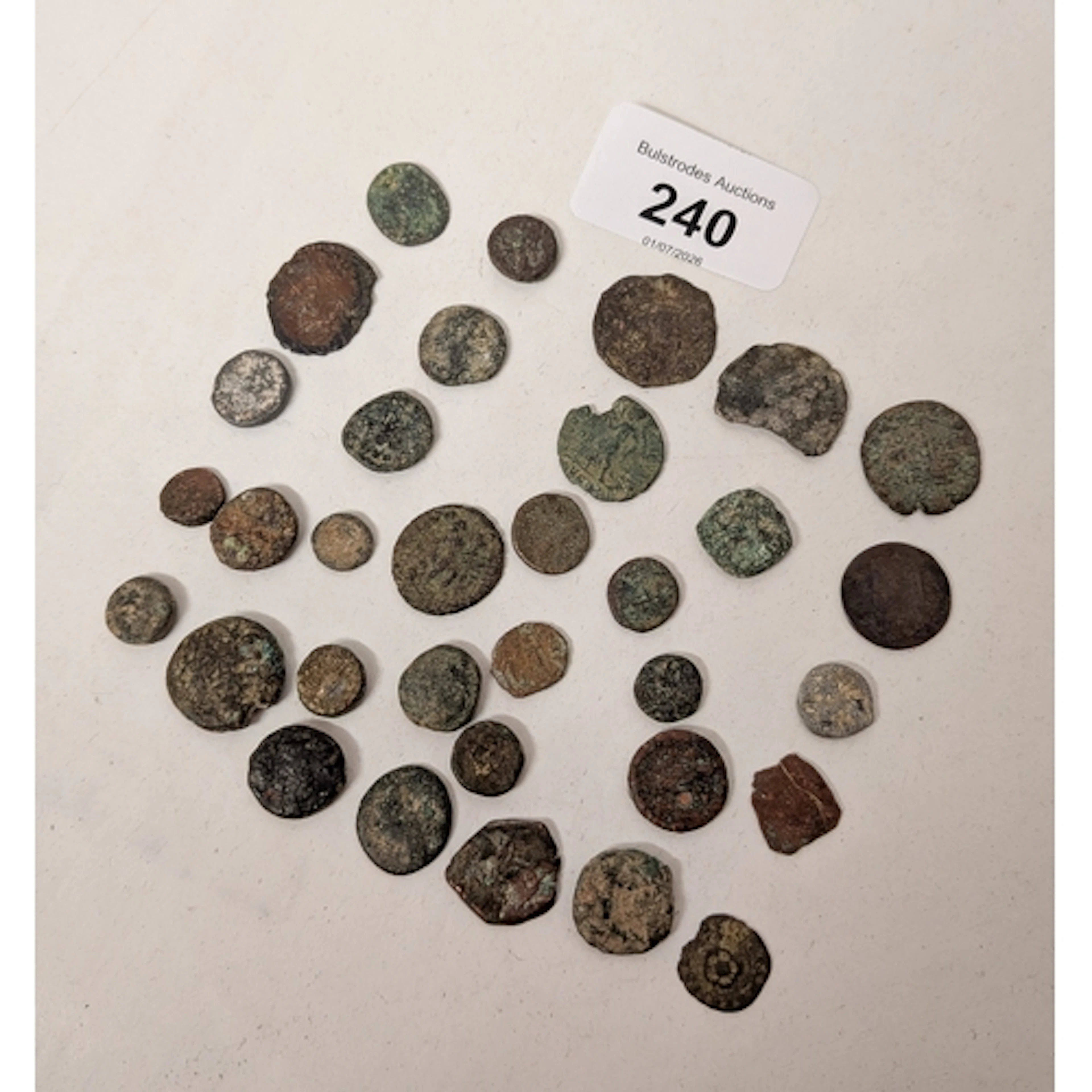 Thirty-three coins, mostly in a excavated state, to include ...