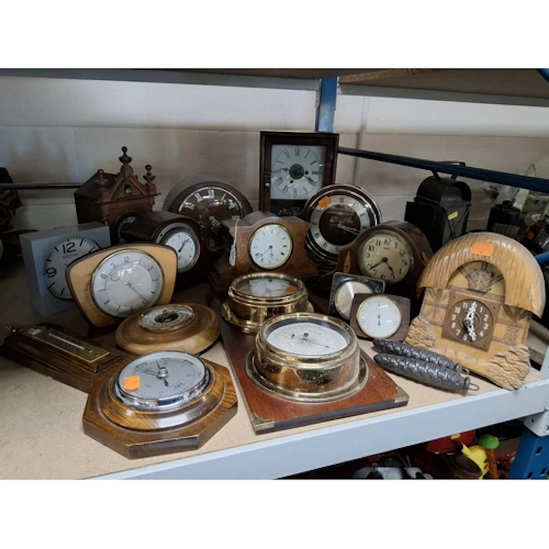 A GROUP OF VINTAGE CLOCKS AND BAROMETERS to include an Art D...