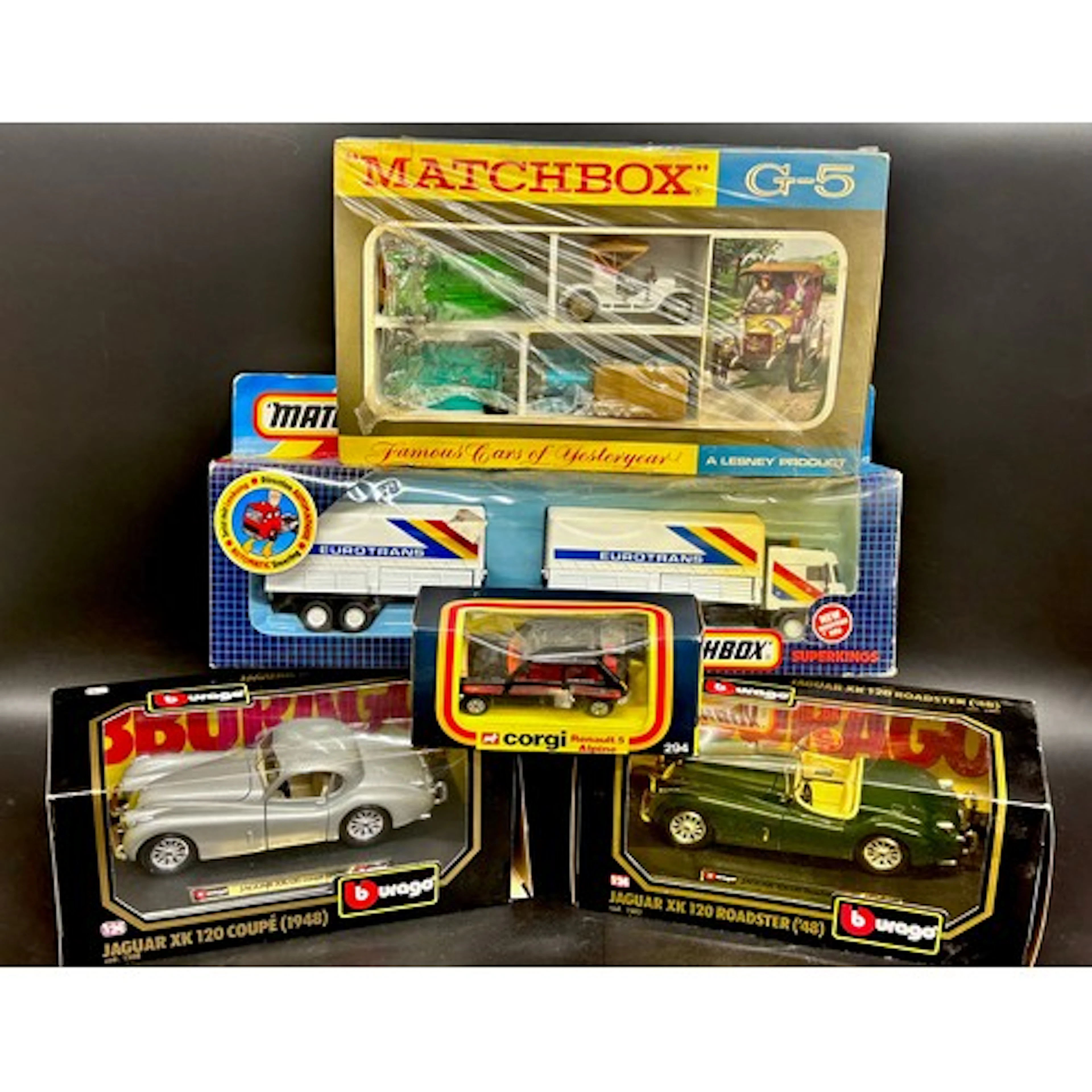 A collection of die-cast model vehicles including Matchbox S...