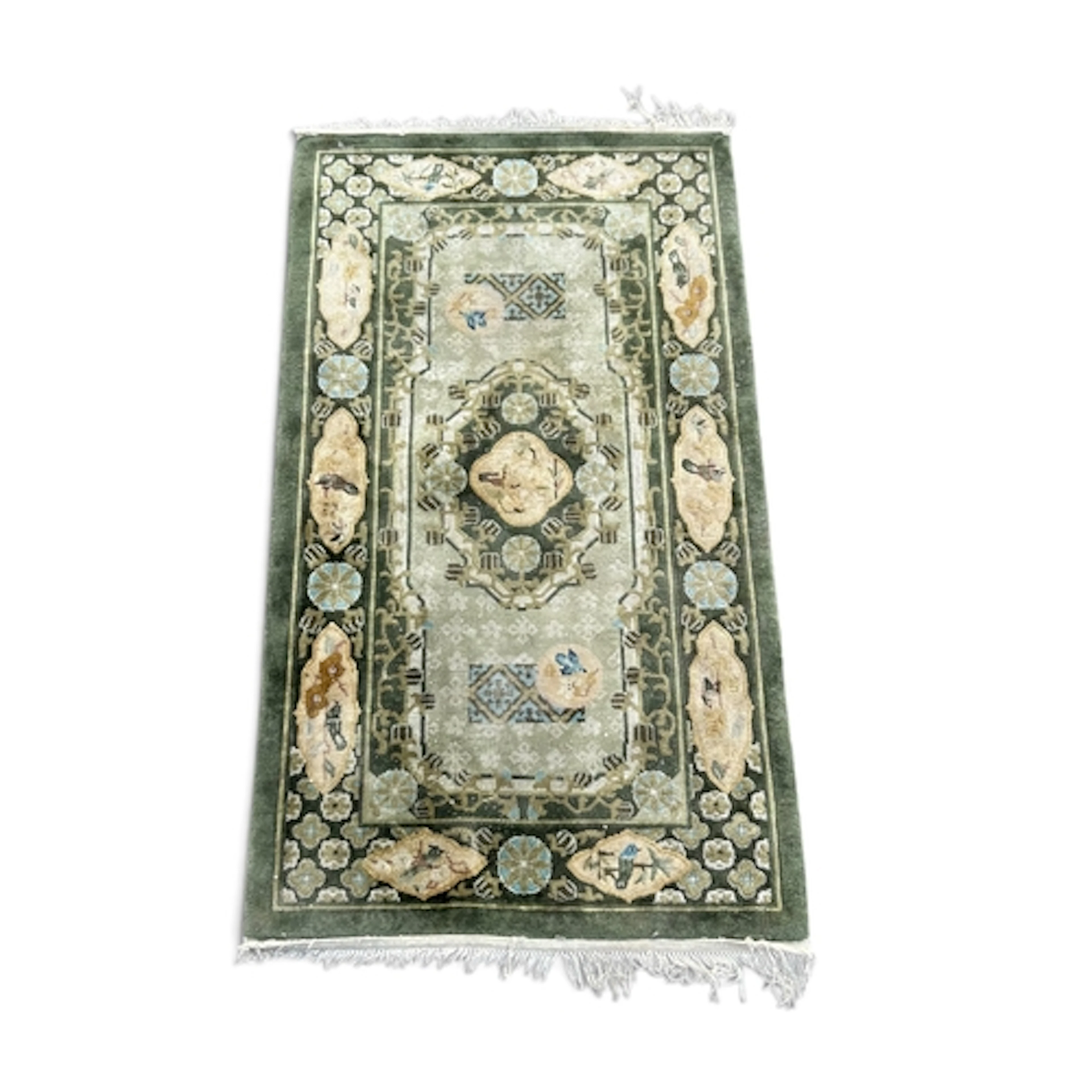 A CHINESE SILK RUG, WITH CENTRAL MEDALLION AGAINST A GREEN G...