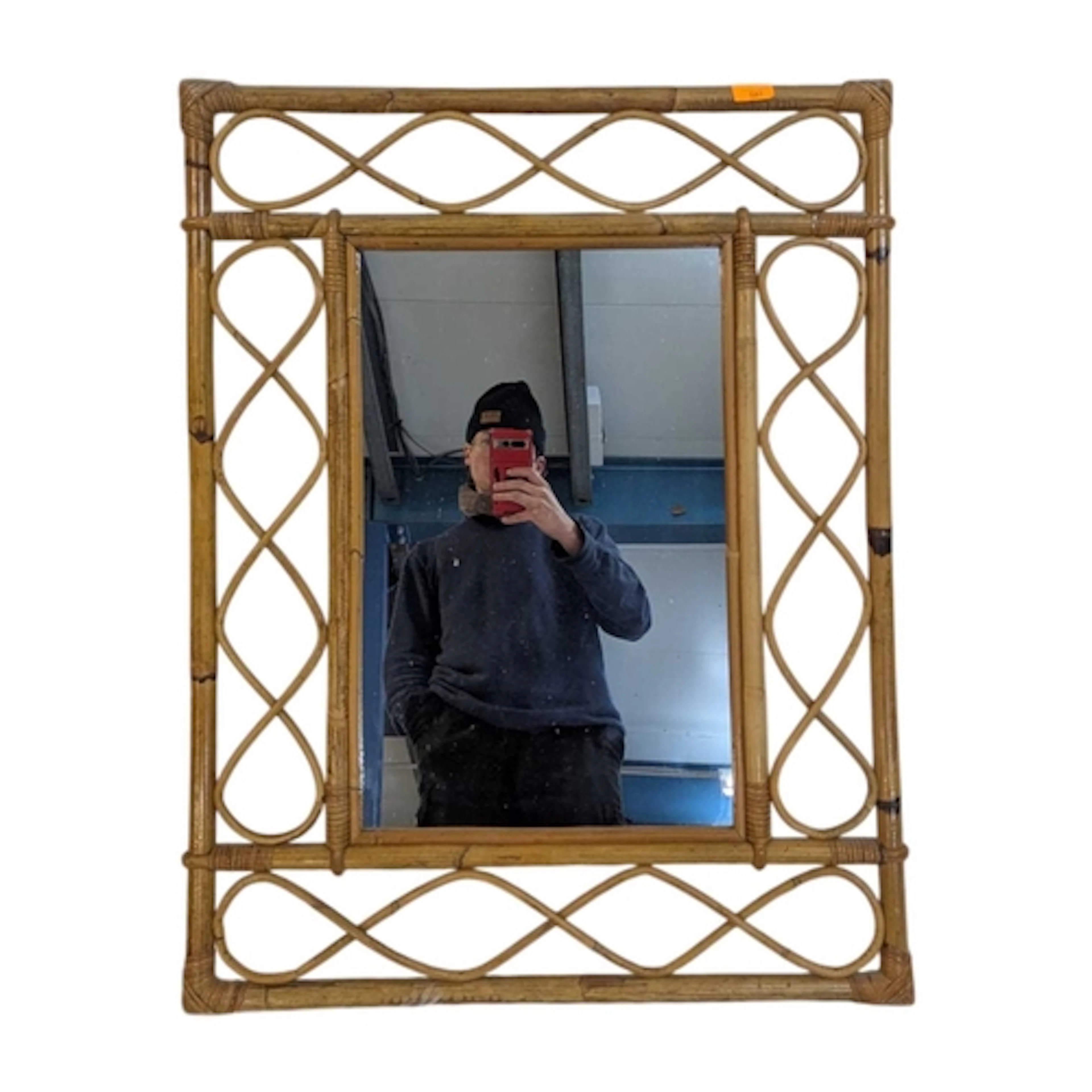 A vintage 20th century circa 1970s bamboo wall mirror. The m...