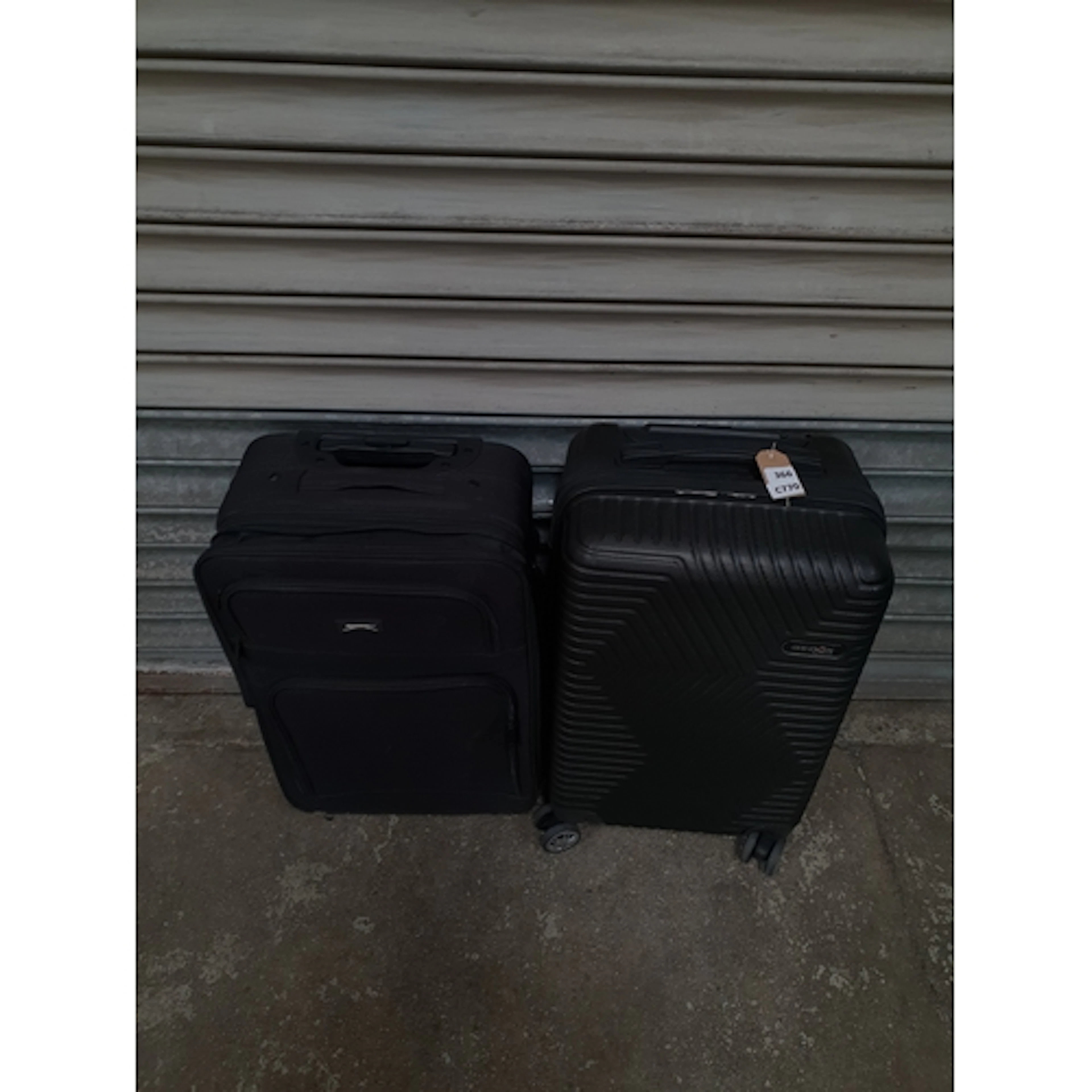 TWO SUITCASES including Puma Note: Suitcases and bags are e...