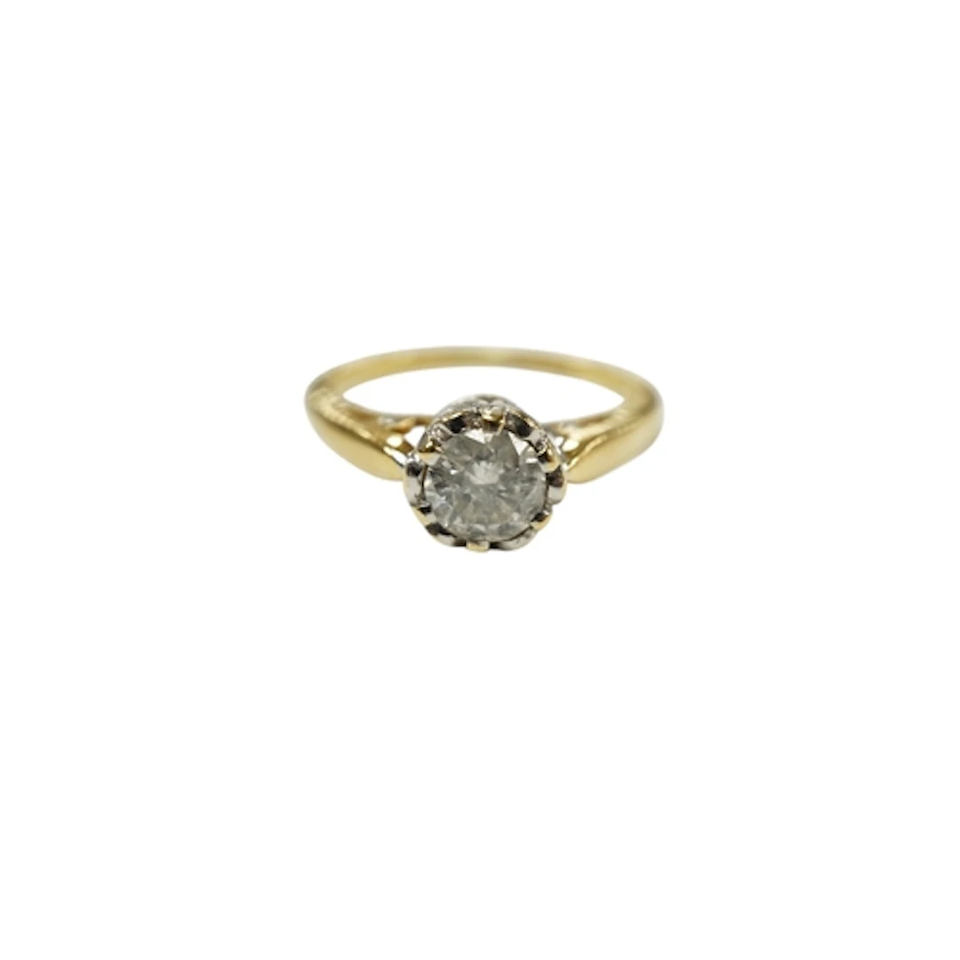 A modern 18ct gold and diamond solitaire ring, size M/N, gro...