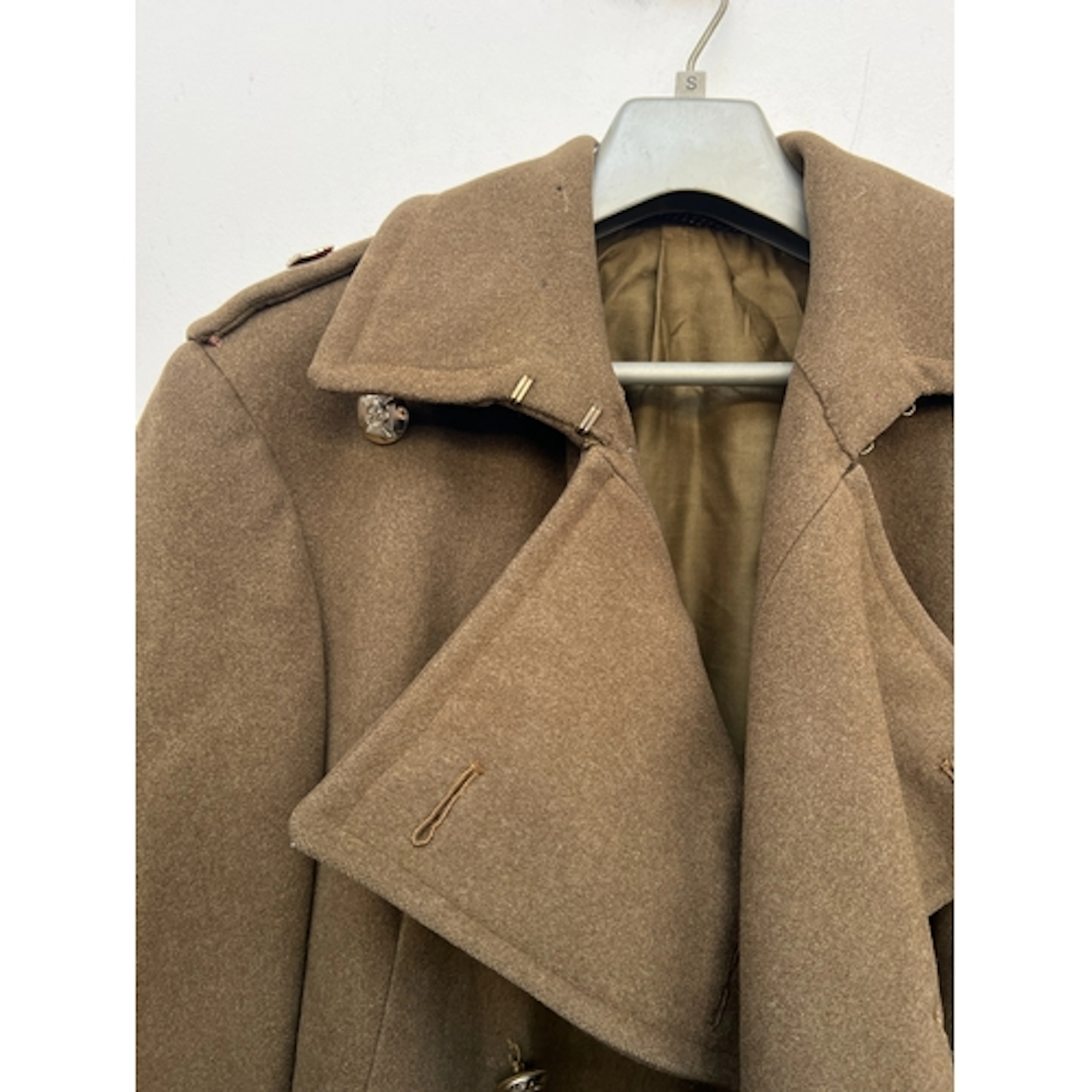 A heavy military wool double breasted overcoat, part lined, ...