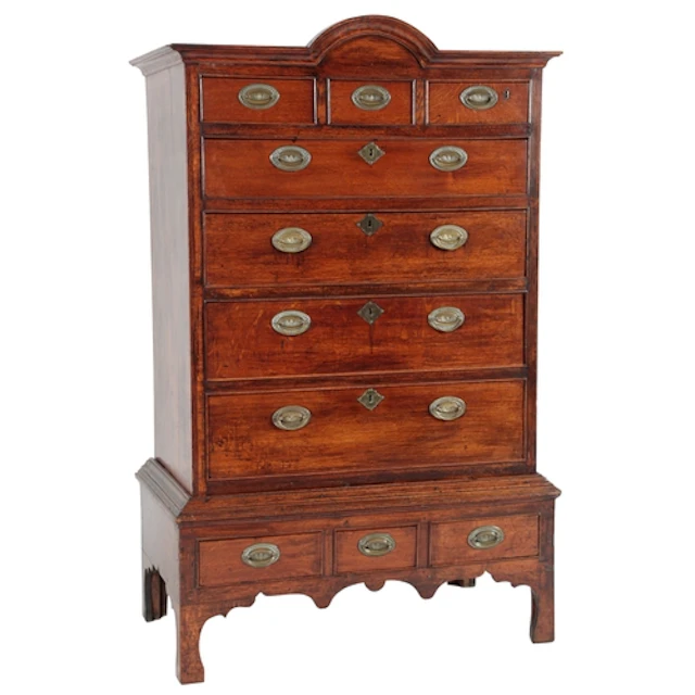 A George III oak chest on stand, with moulded domed cornice ...