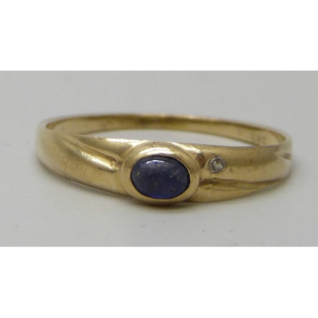 A 14k gold, sapphire and diamond ring (sapphire a/f), 1.3g, ...