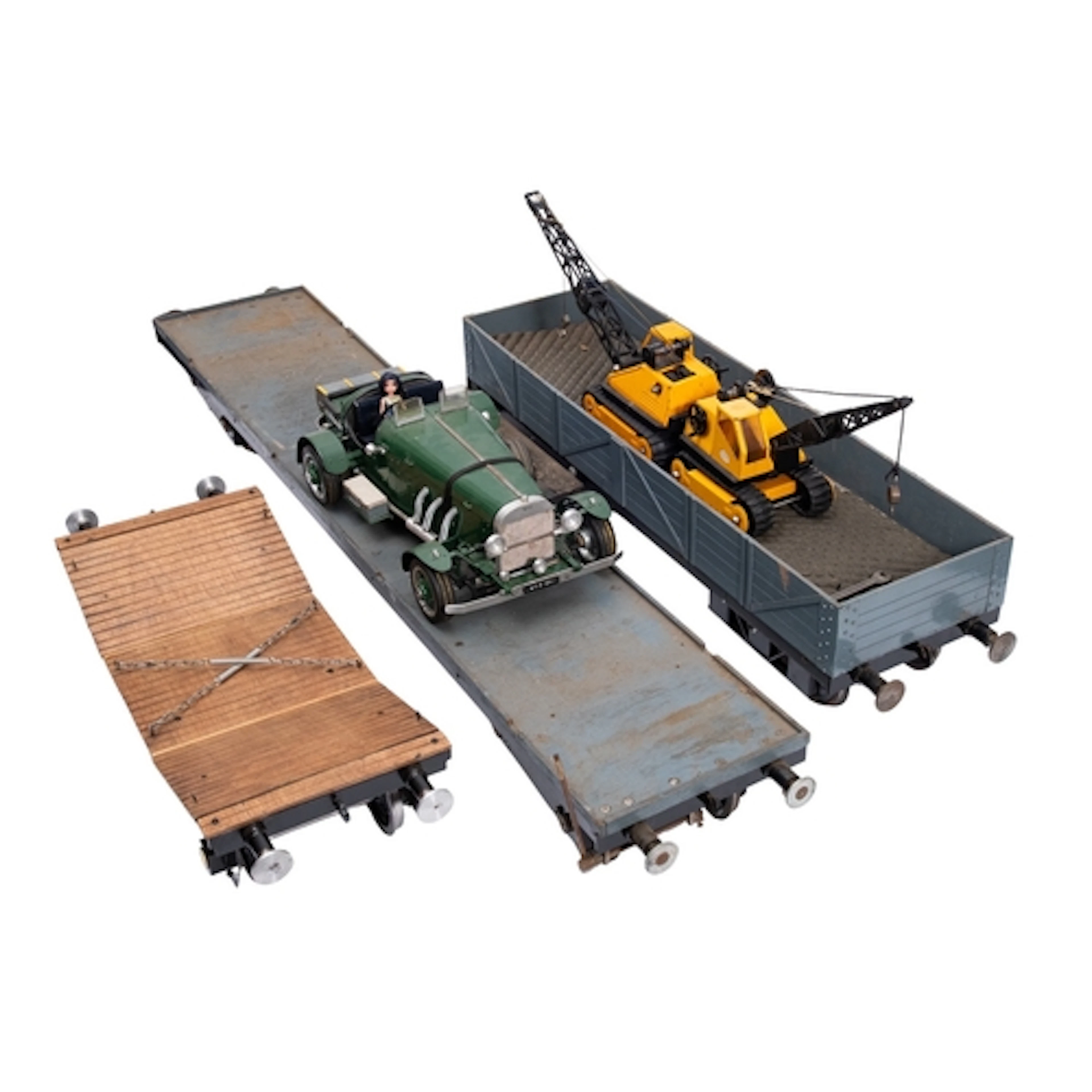 Two scratch built gauge five flatbed trucks. Both having woo...