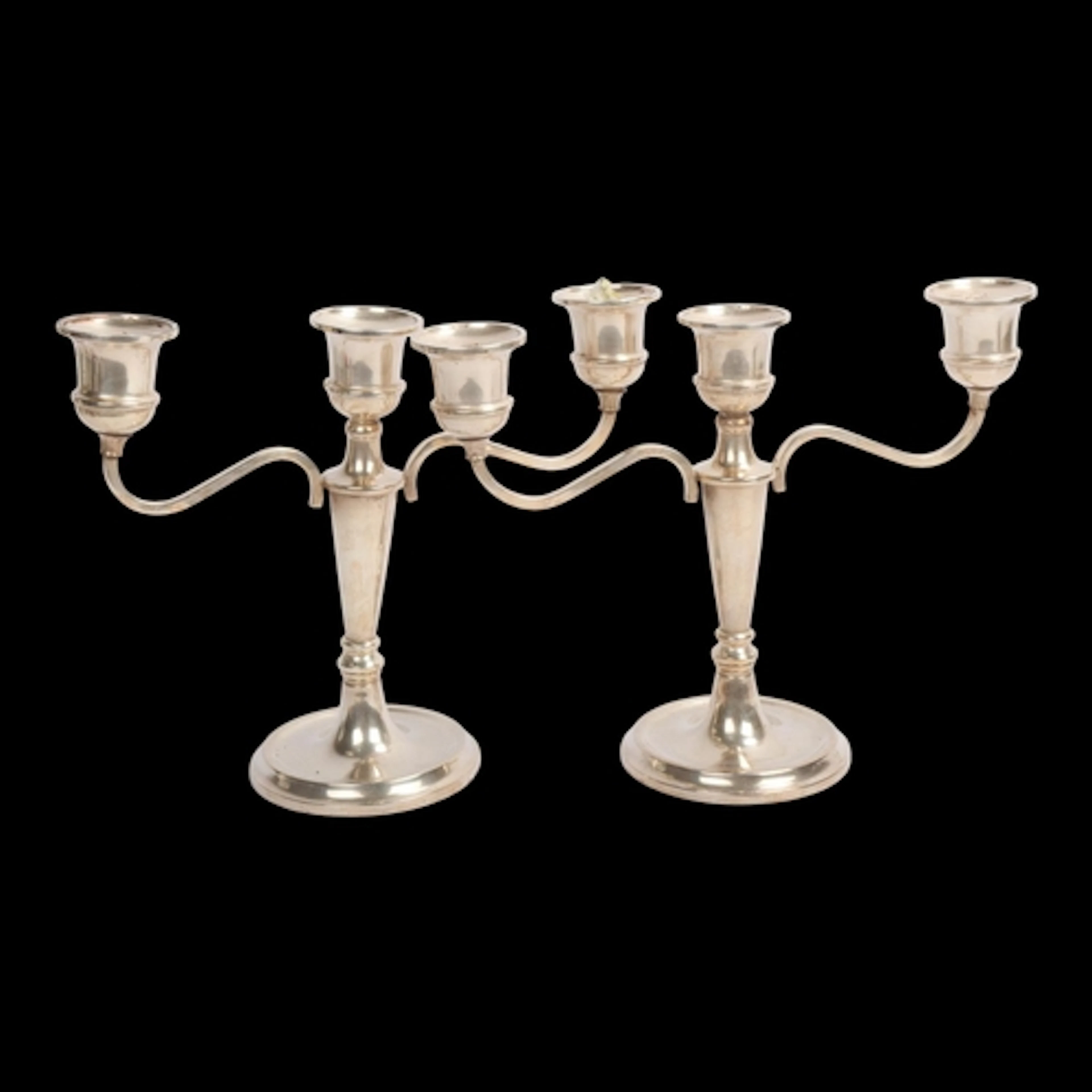 A pair of Elizabeth II silver 3-light table candelabra, W I ...
