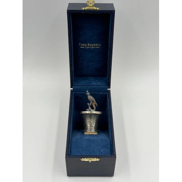 A Theo Fennell hallmarked silver falcon figural wine bottle ...