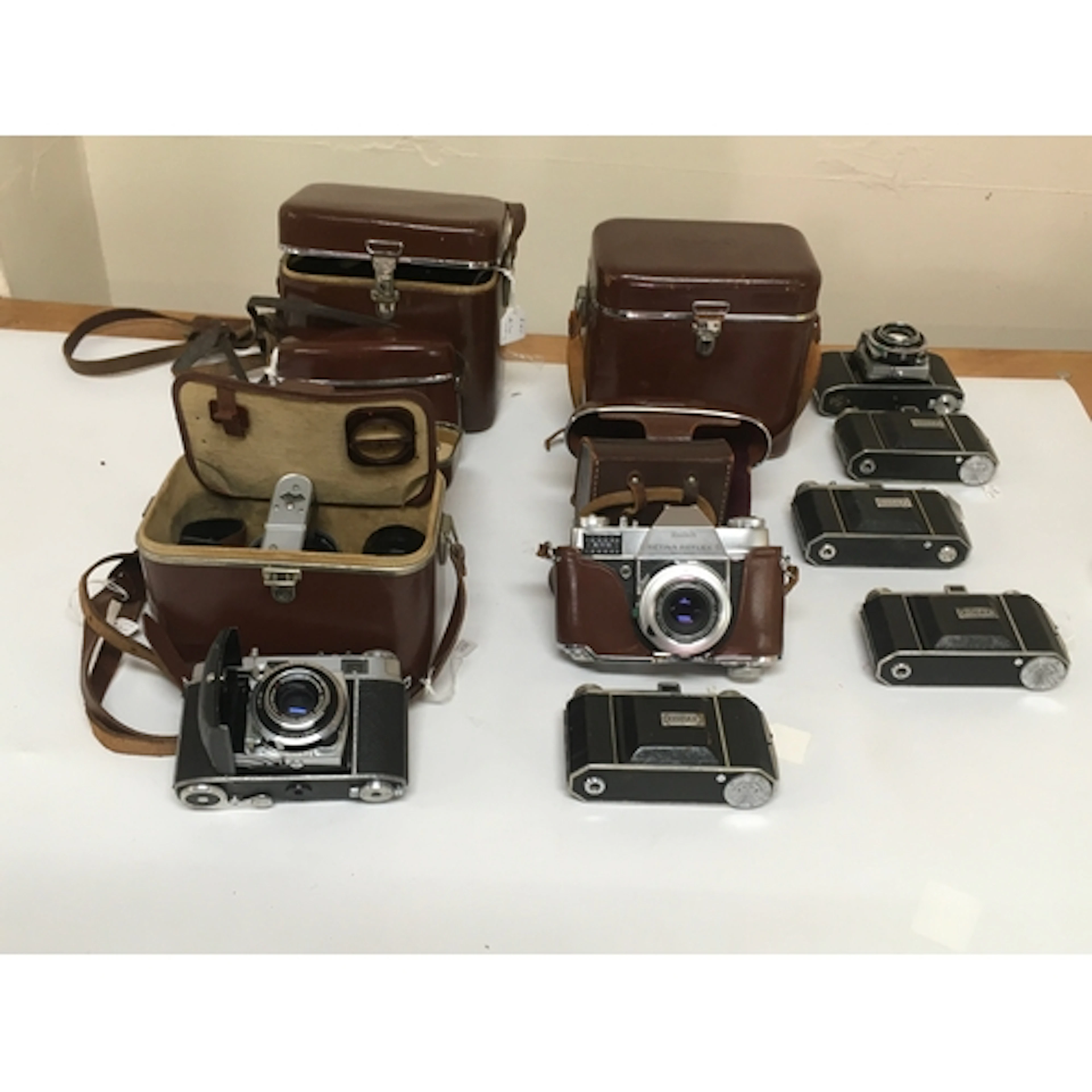 10 Kodak cameras. 1 Retina Reflex S with additional capabili...