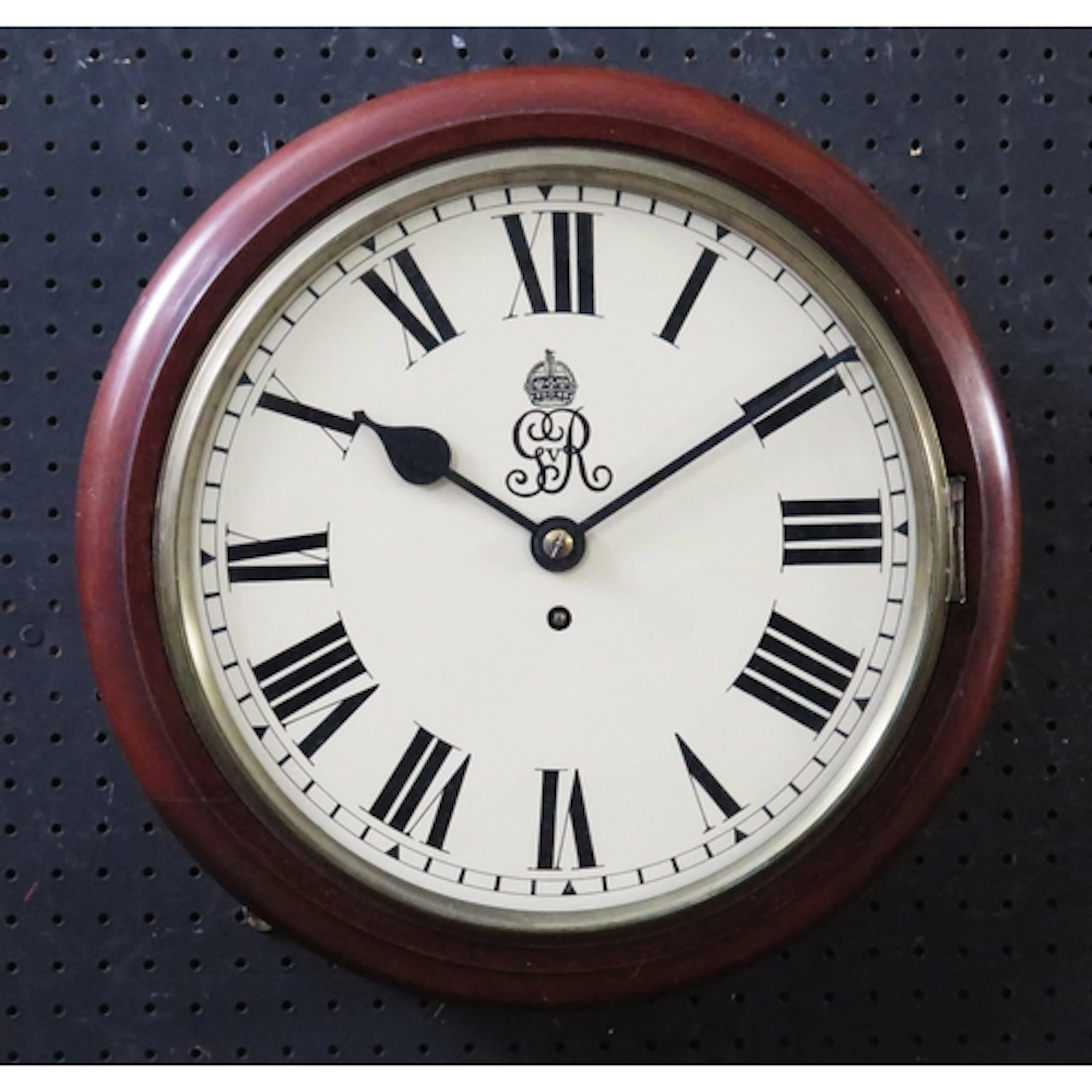A George V wall mounted timepiece with 30cm Roman dial and G...