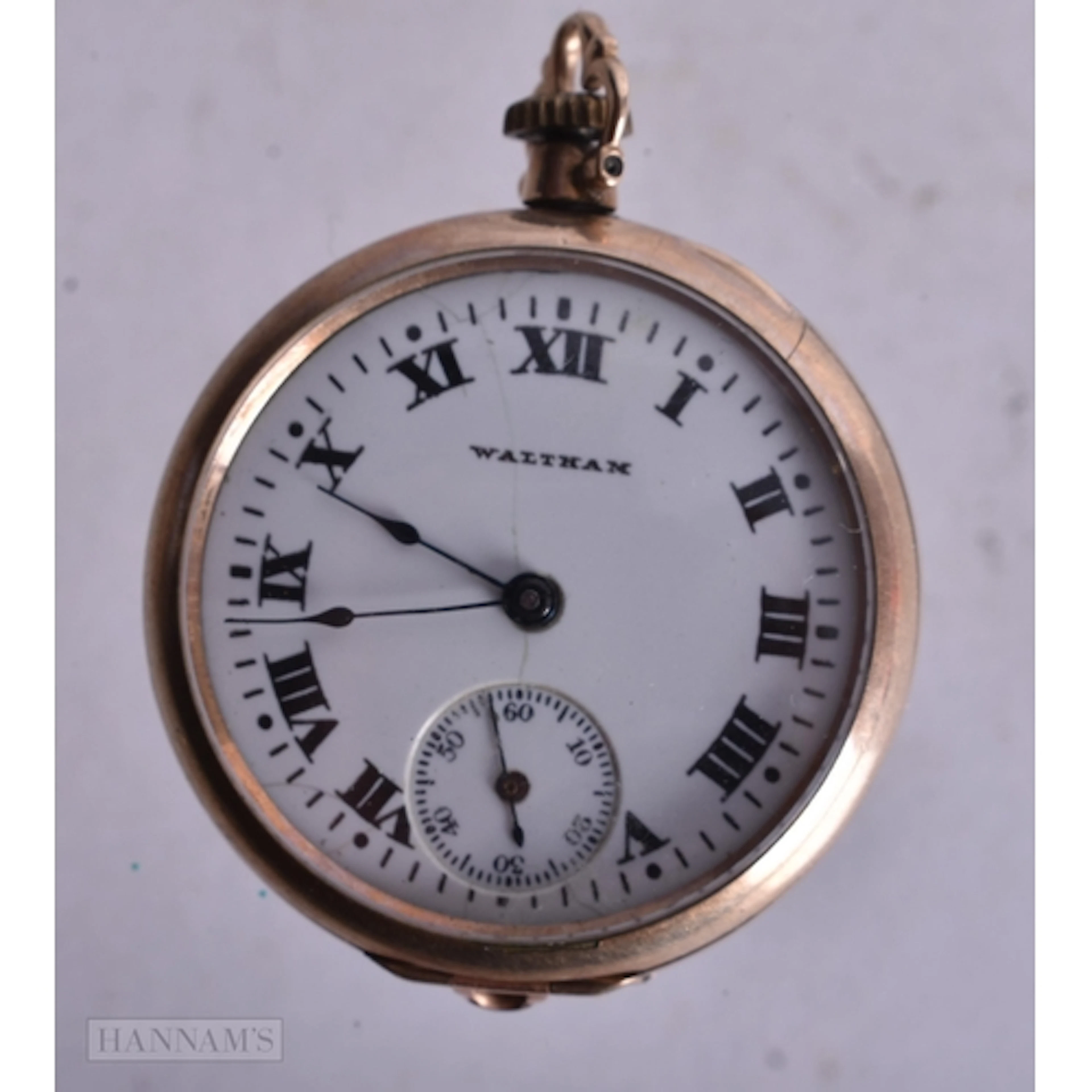 A WALTHAM POCKET WATCH. Not running. 3 cm wide.