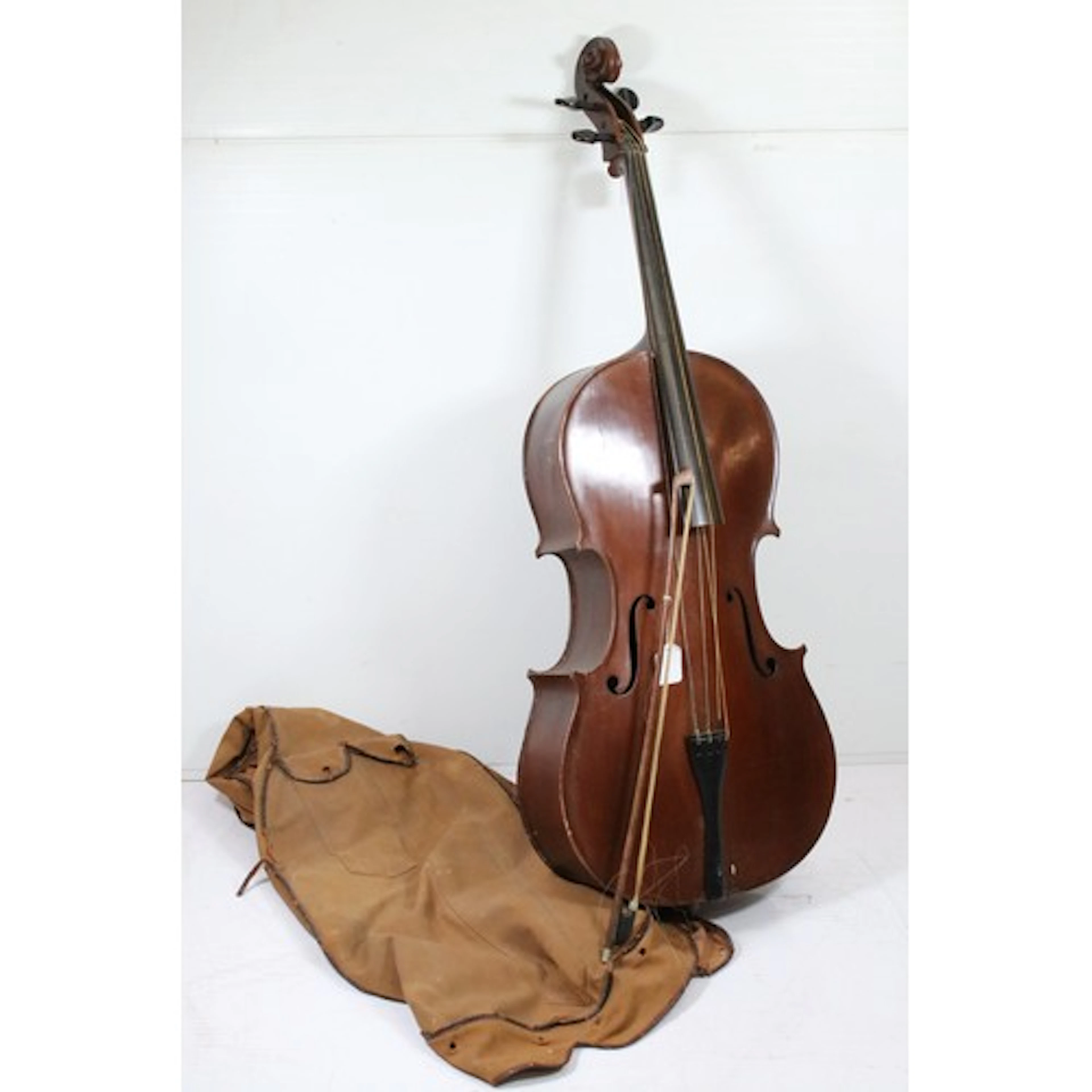 Early to mid 20th century cello, having scrolling head and F...