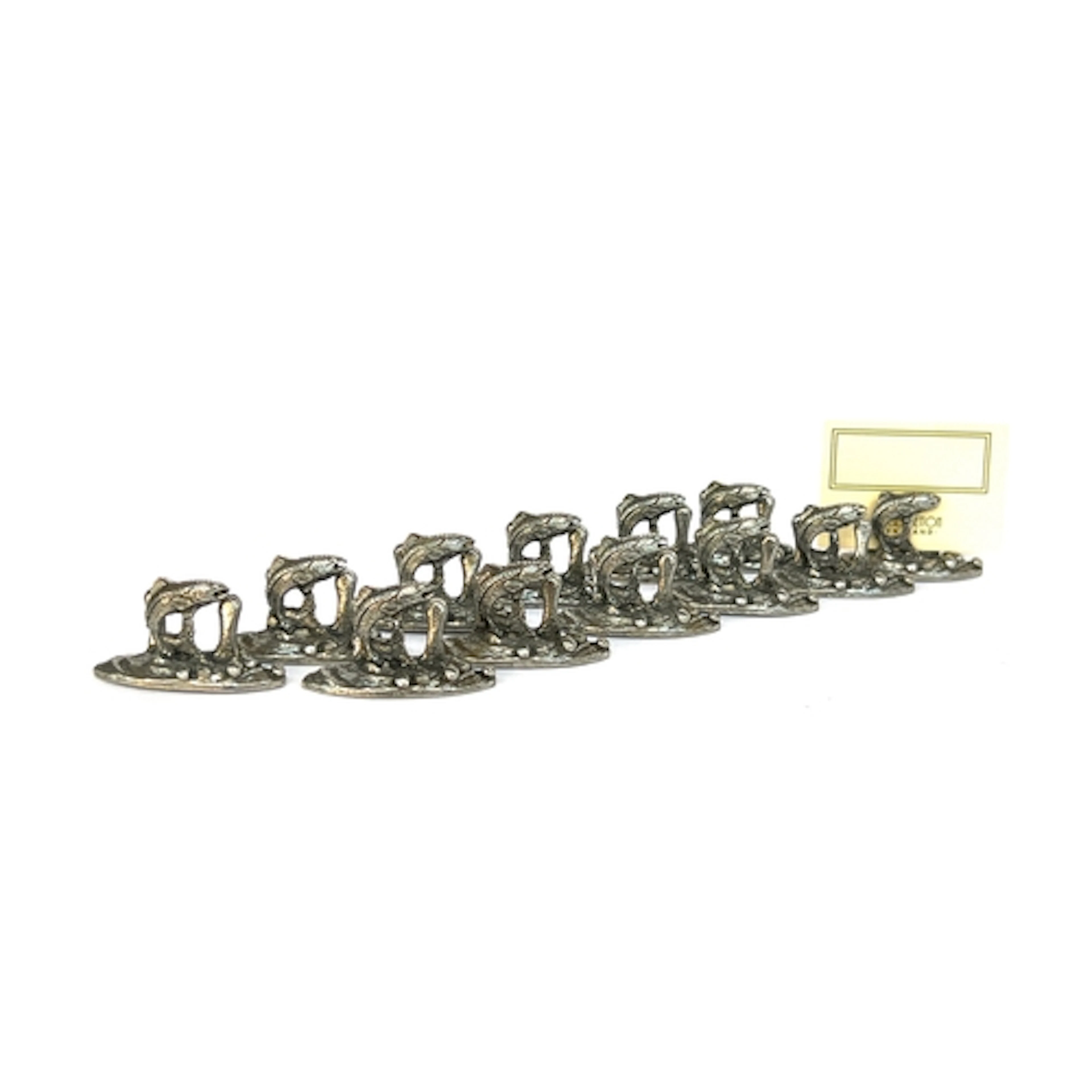A set of twelve leaping salmon place name holders by Woodset...