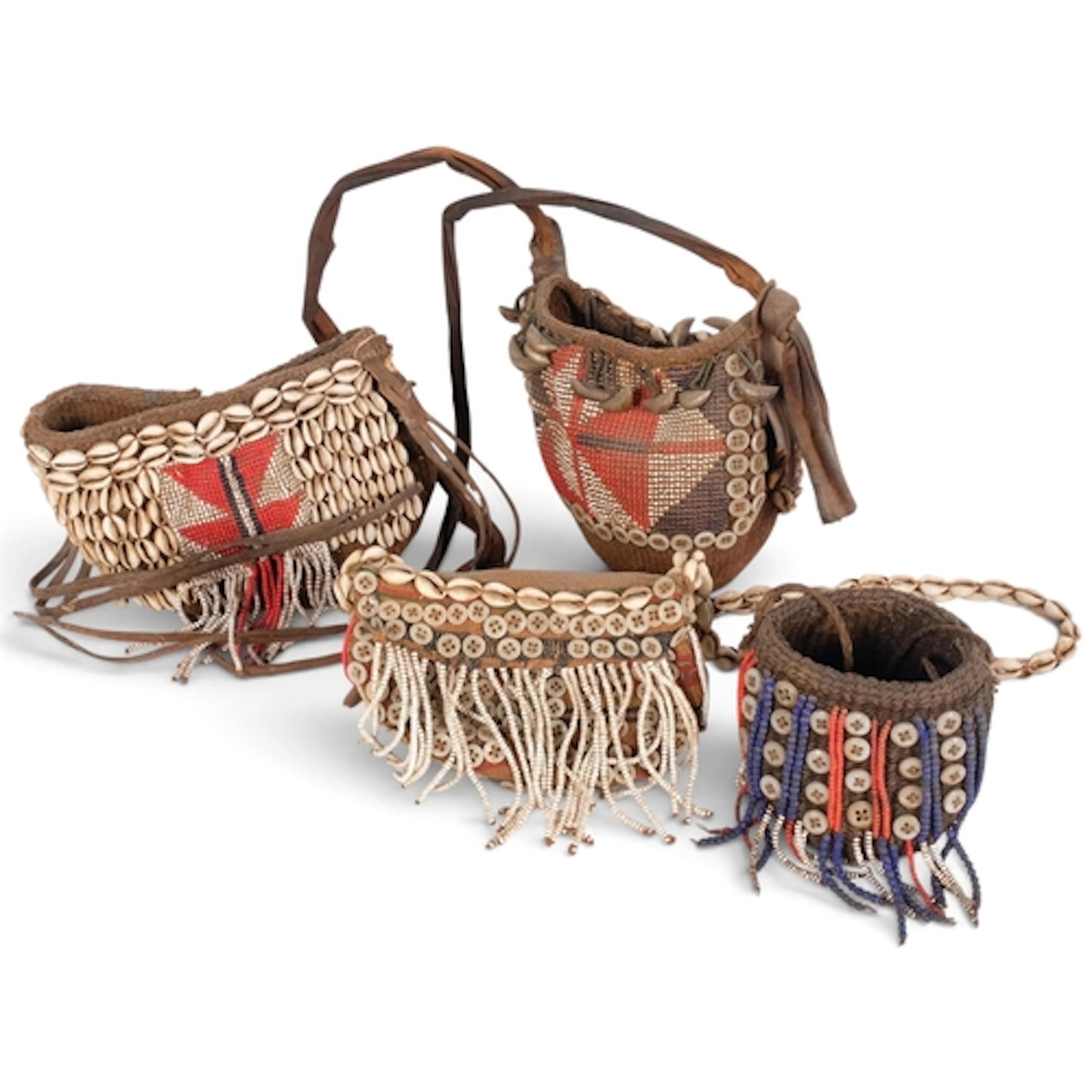 A group of Vintage African Tribal baskets, with cowrie shell...