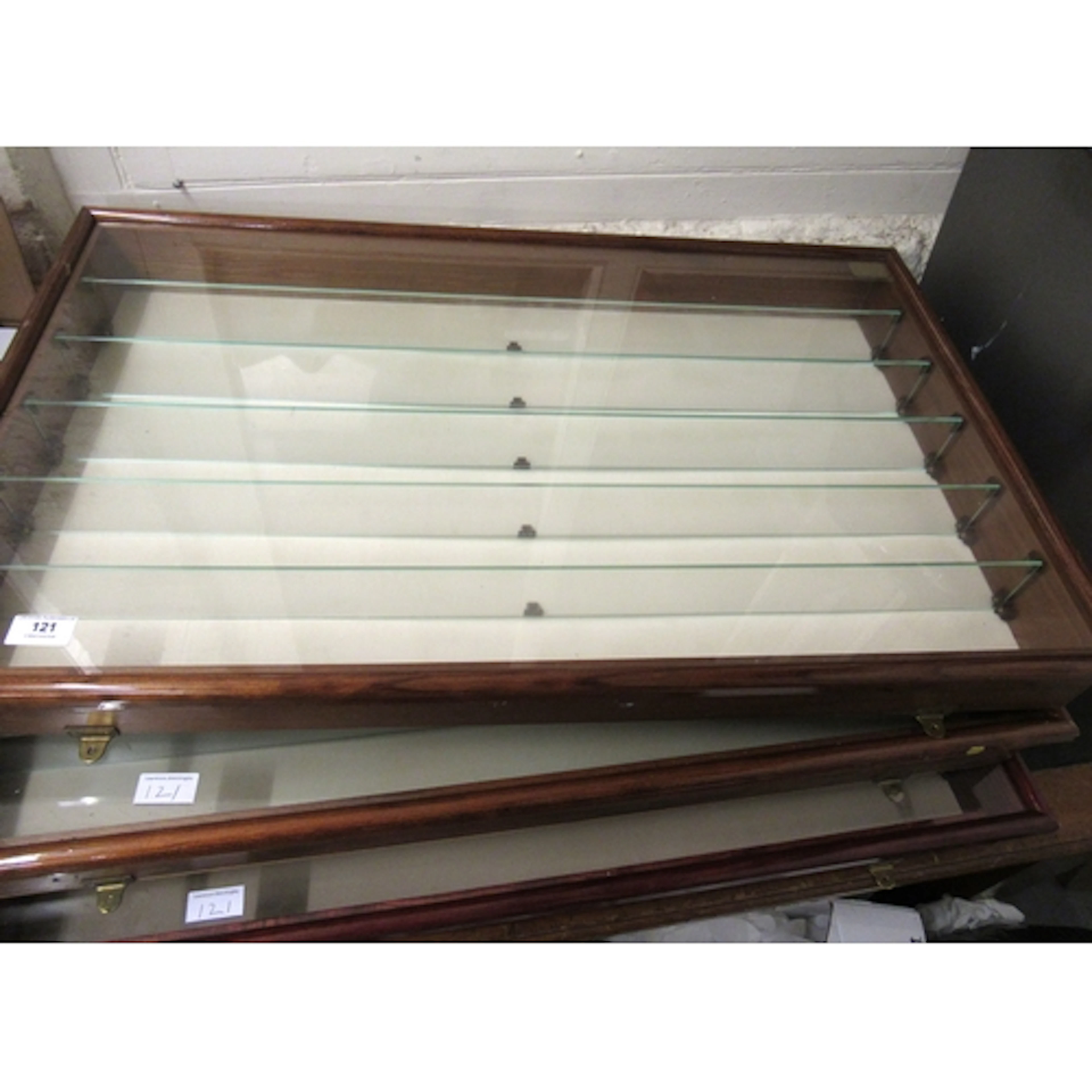Group of four various model car display cabinets, the larges...