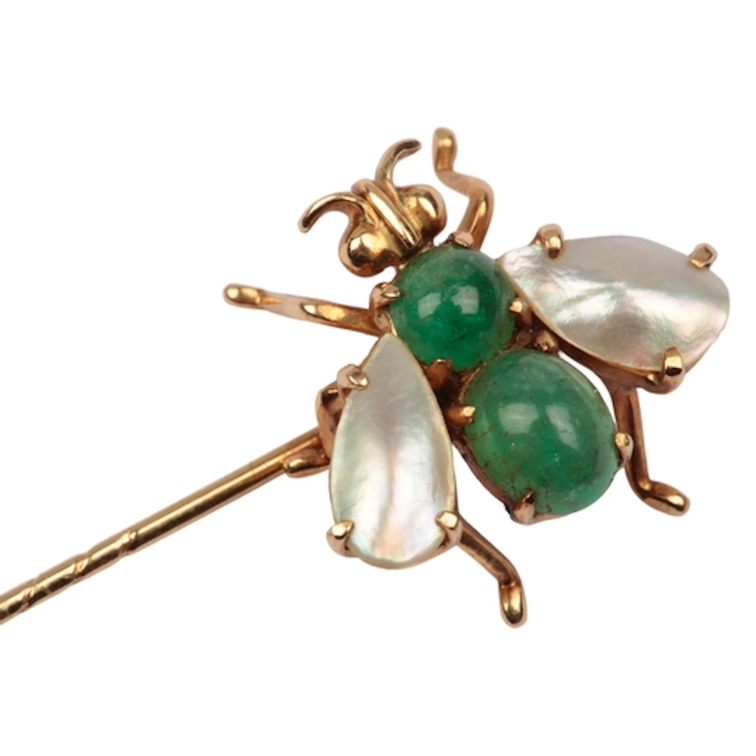 An emerald and mother of pearl stick pin, mid 20th century, ...