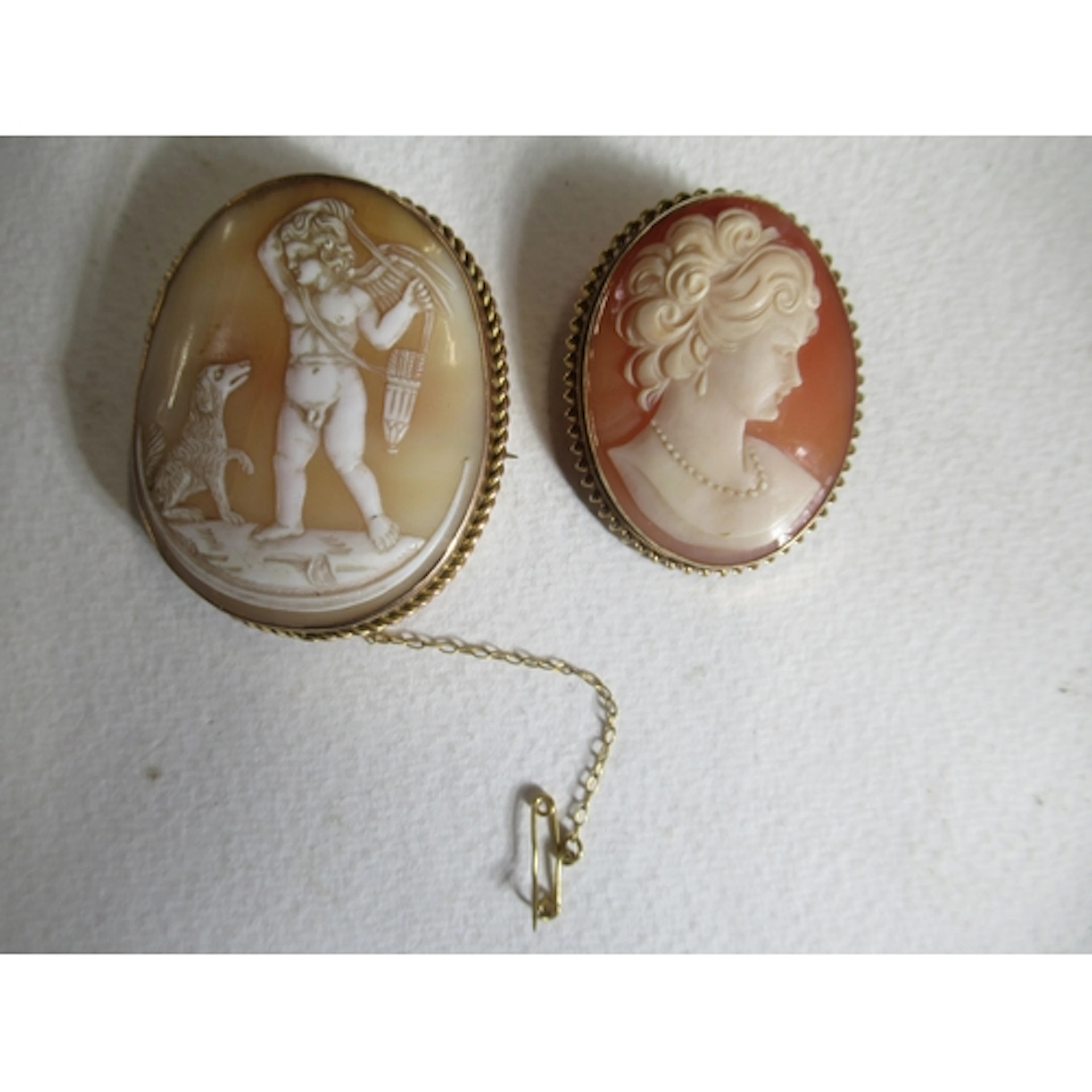 Two cameo brooches, one in 9ct gold mount