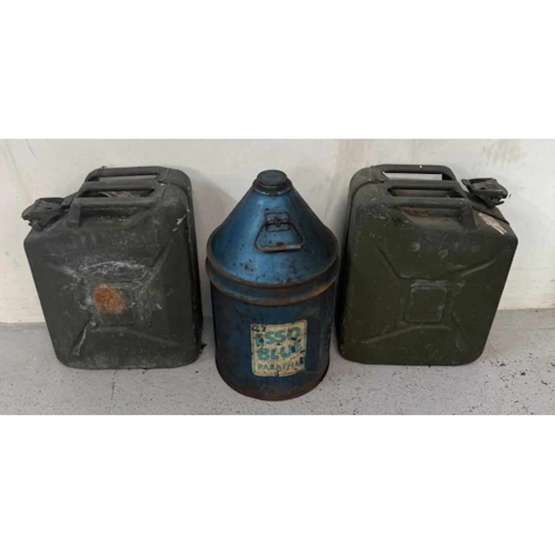A vintage Esso Blue Paraffin can and two Jerry cans.