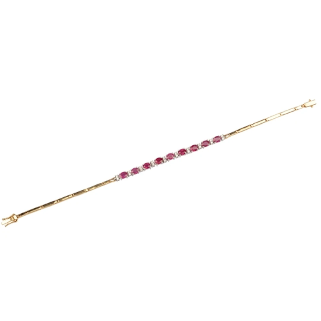 A ruby and diamond bracelet, centring on an articulated line...