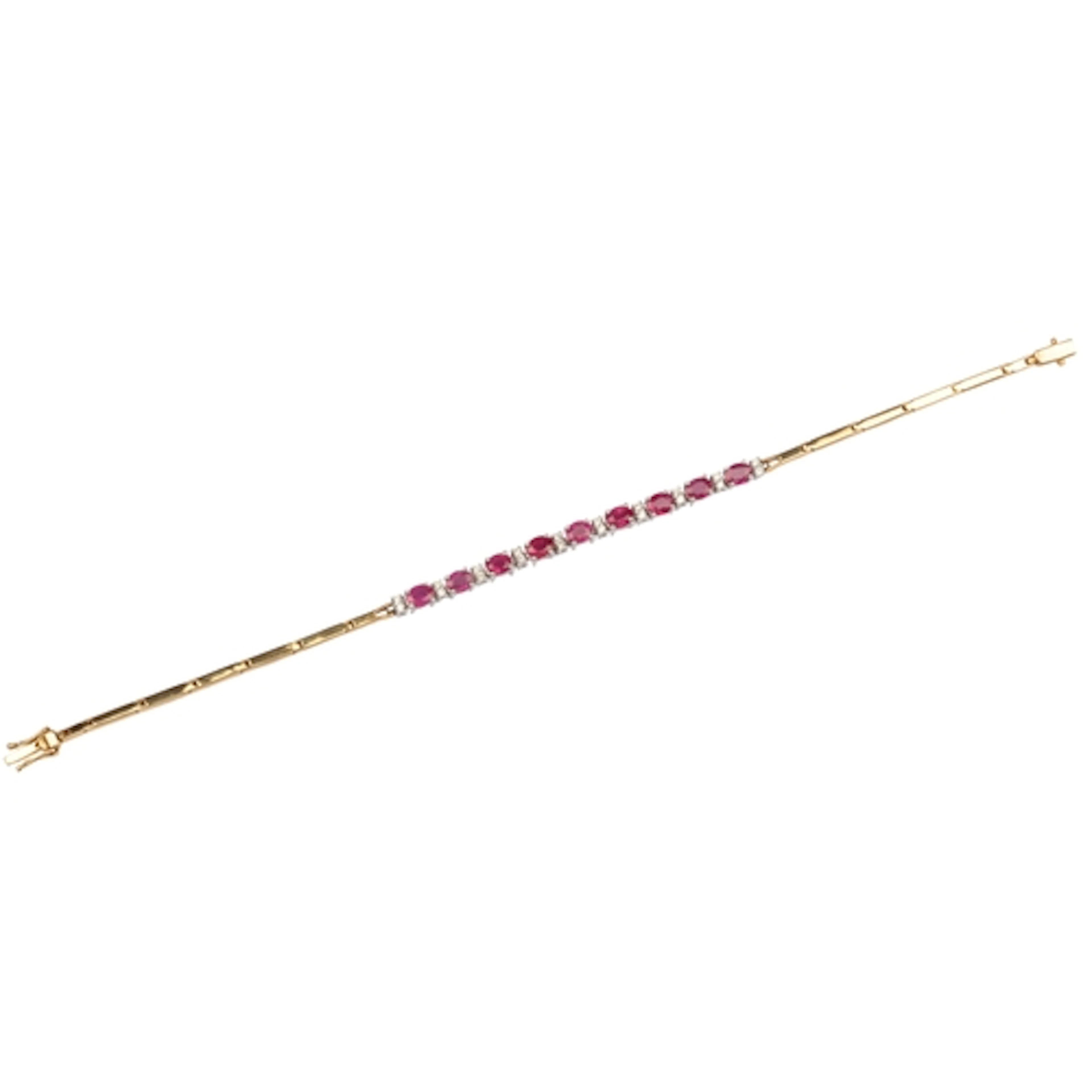 A ruby and diamond bracelet, centring on an articulated line...