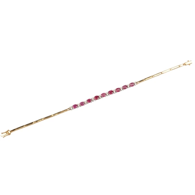 A ruby and diamond bracelet, centring on an articulated line...