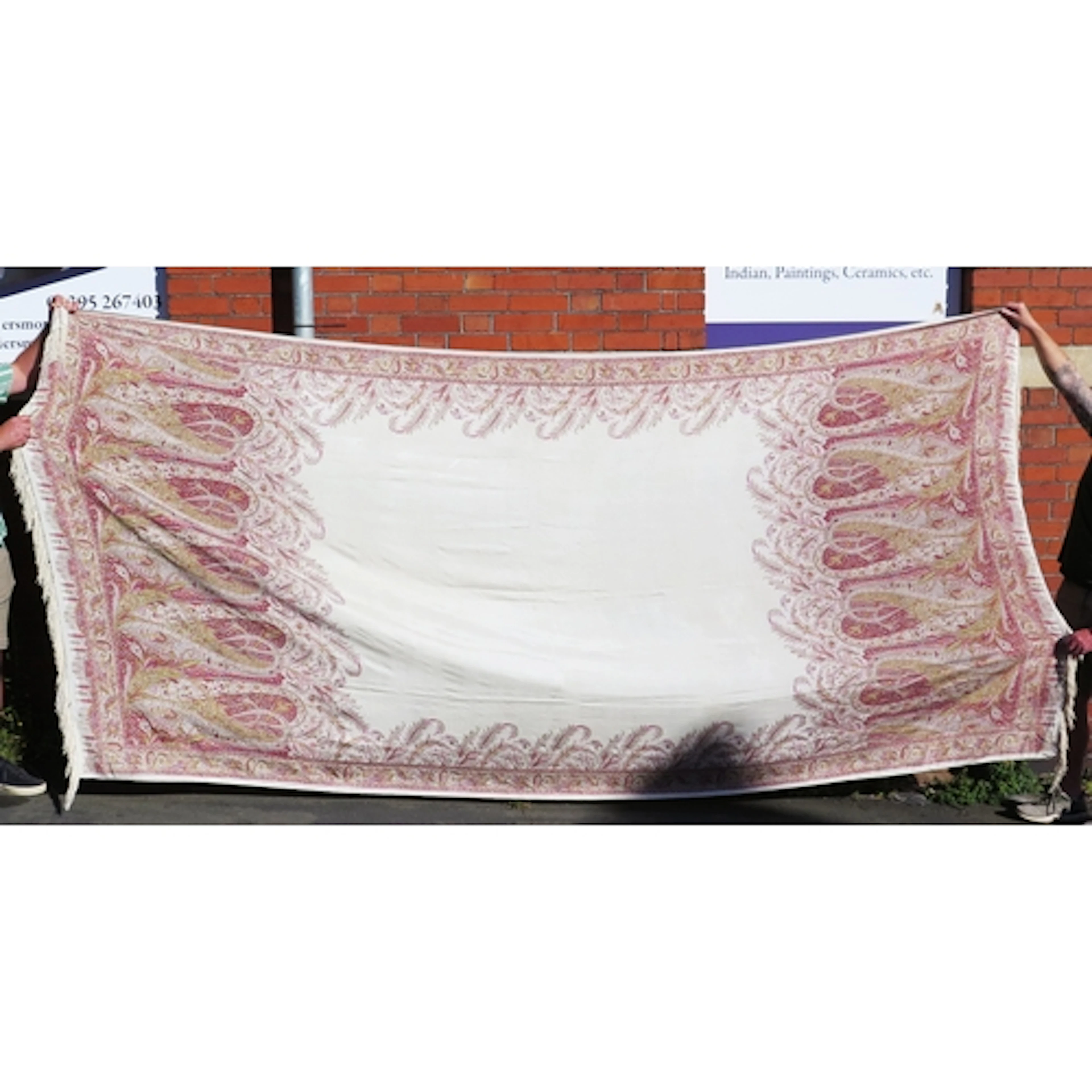 A late Victorian silk piano shawl, with paisley design to an...
