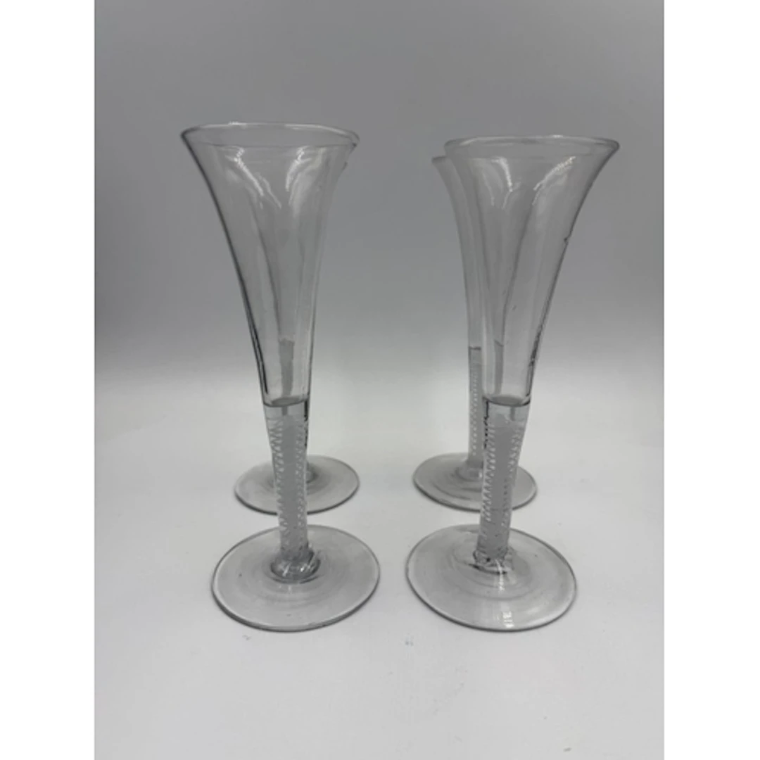 A set of four Georgian air twist stem ale glasses.