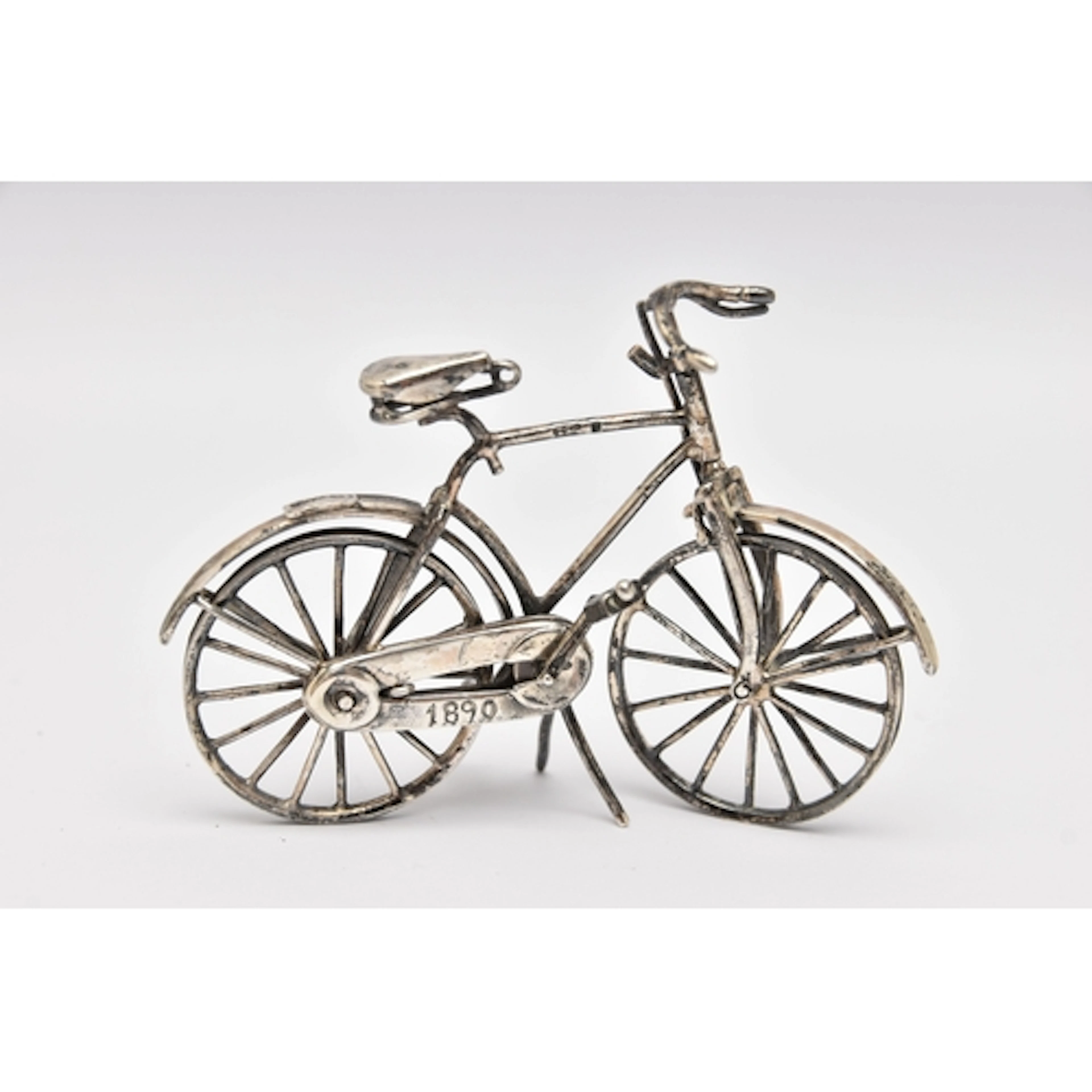 A WHITE METAL MINIATURE BIKE MODEL, stamped 925 Italian mark...