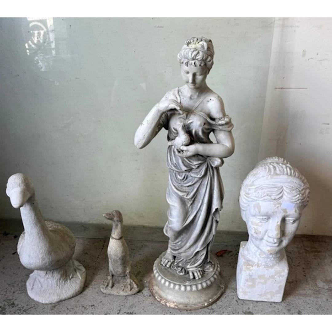 A Selection of plaster and concrete garden statues to includ...