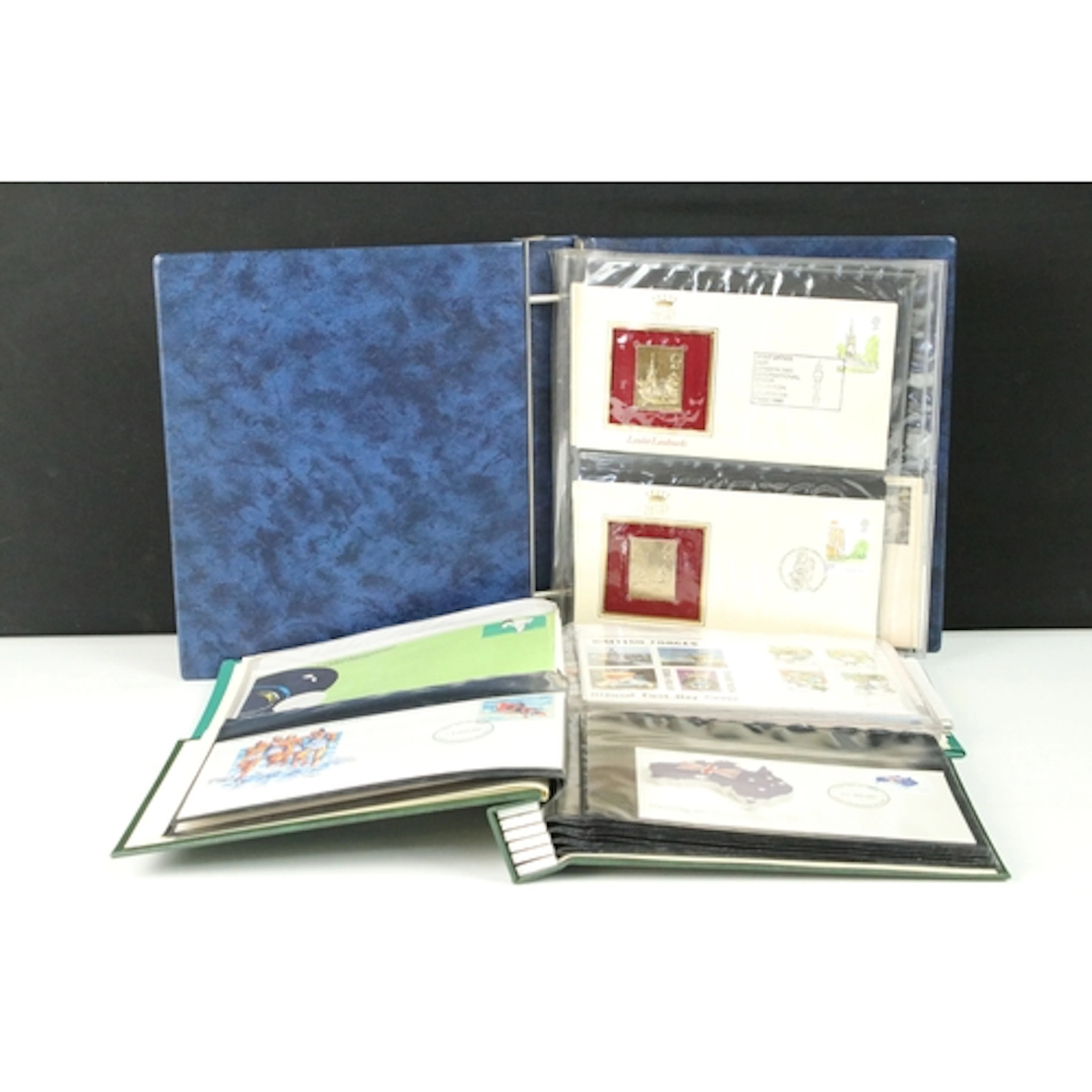 Three albums of First Day Covers to include an album of 22ct...
