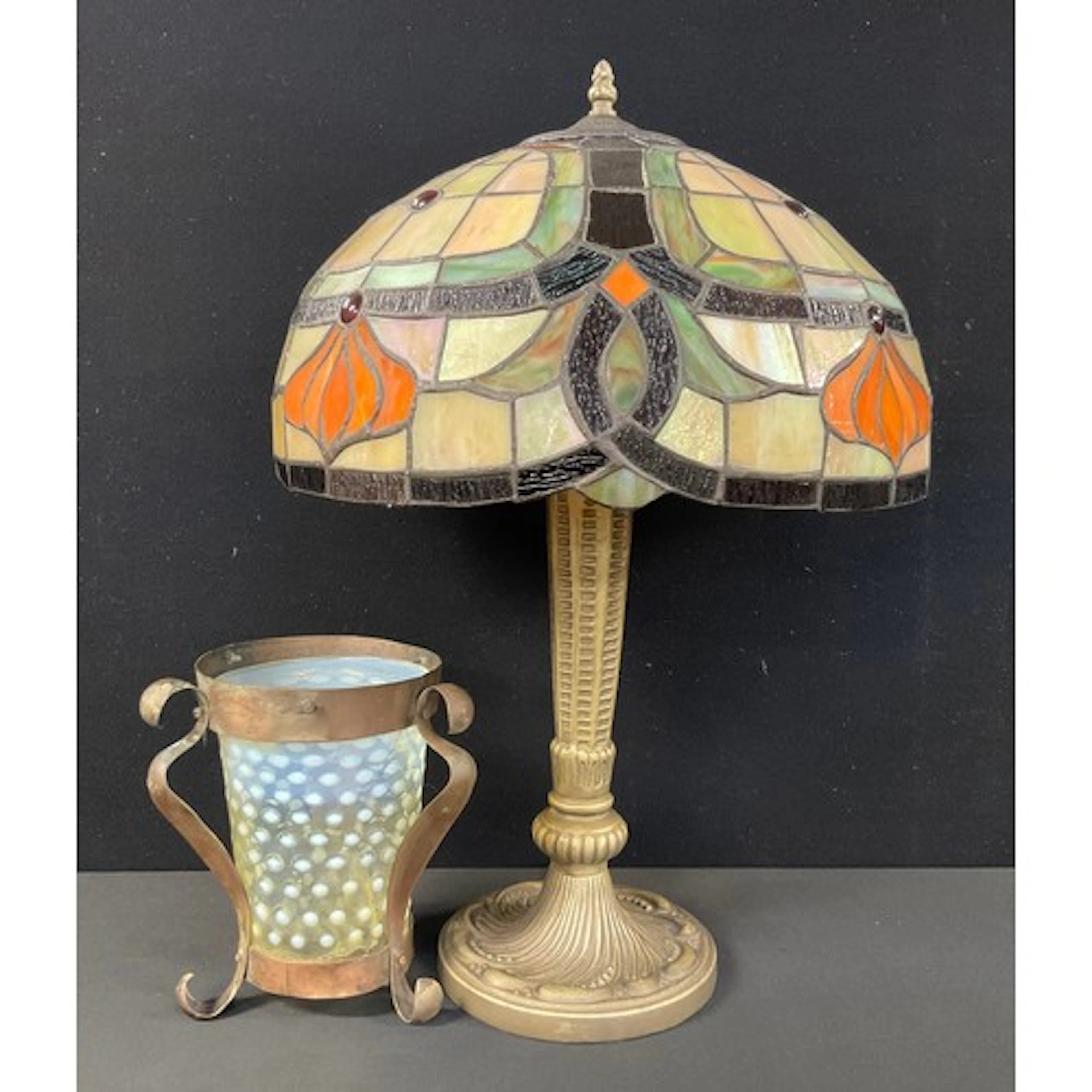 A Tiffany style table lamp, the shade’s stained glass finish...