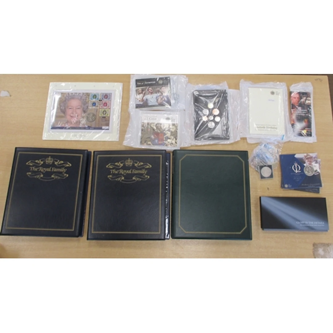 Collection of world uncirculated coin covers in albums (3) i...