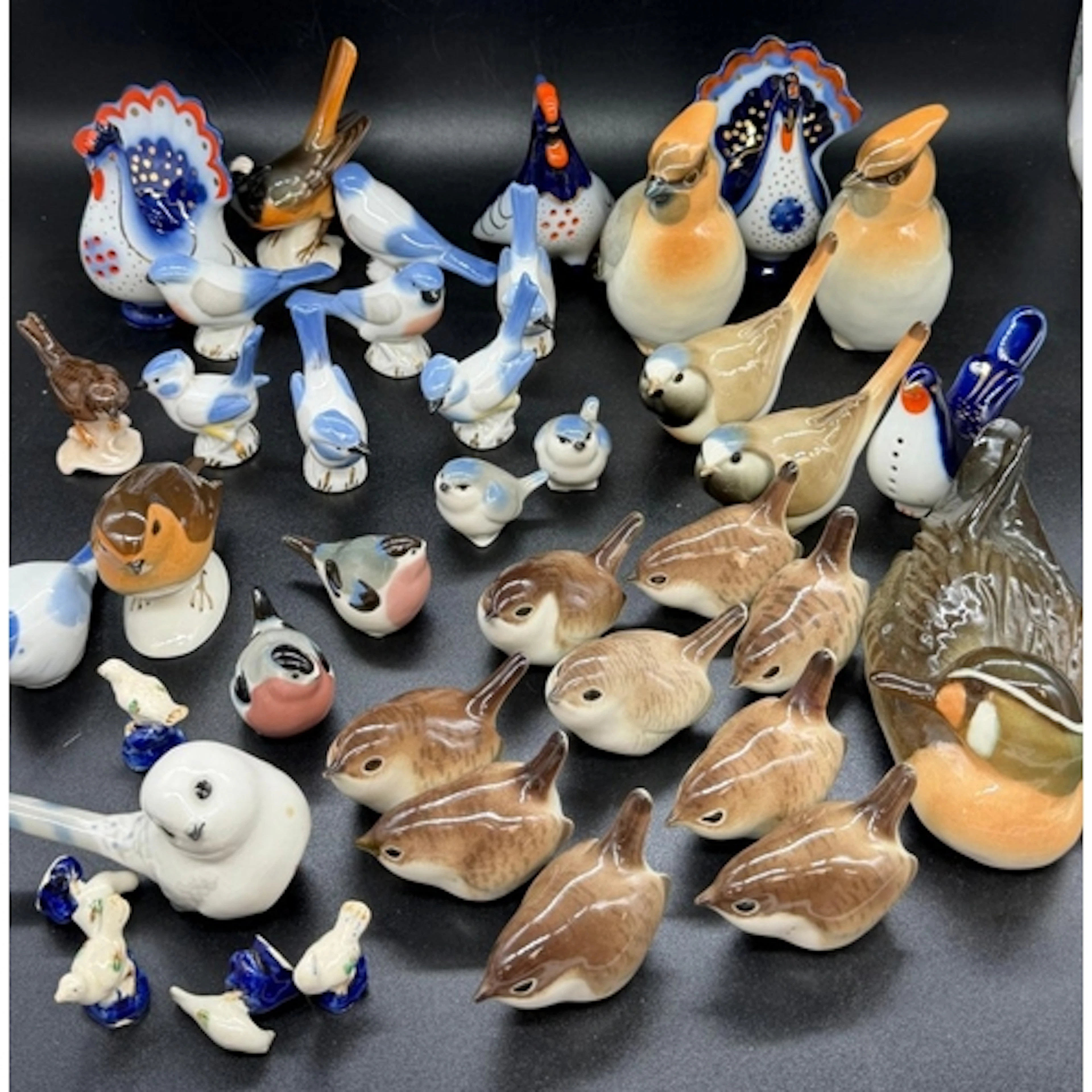 A small collection of porcelain birds stamped USSR
