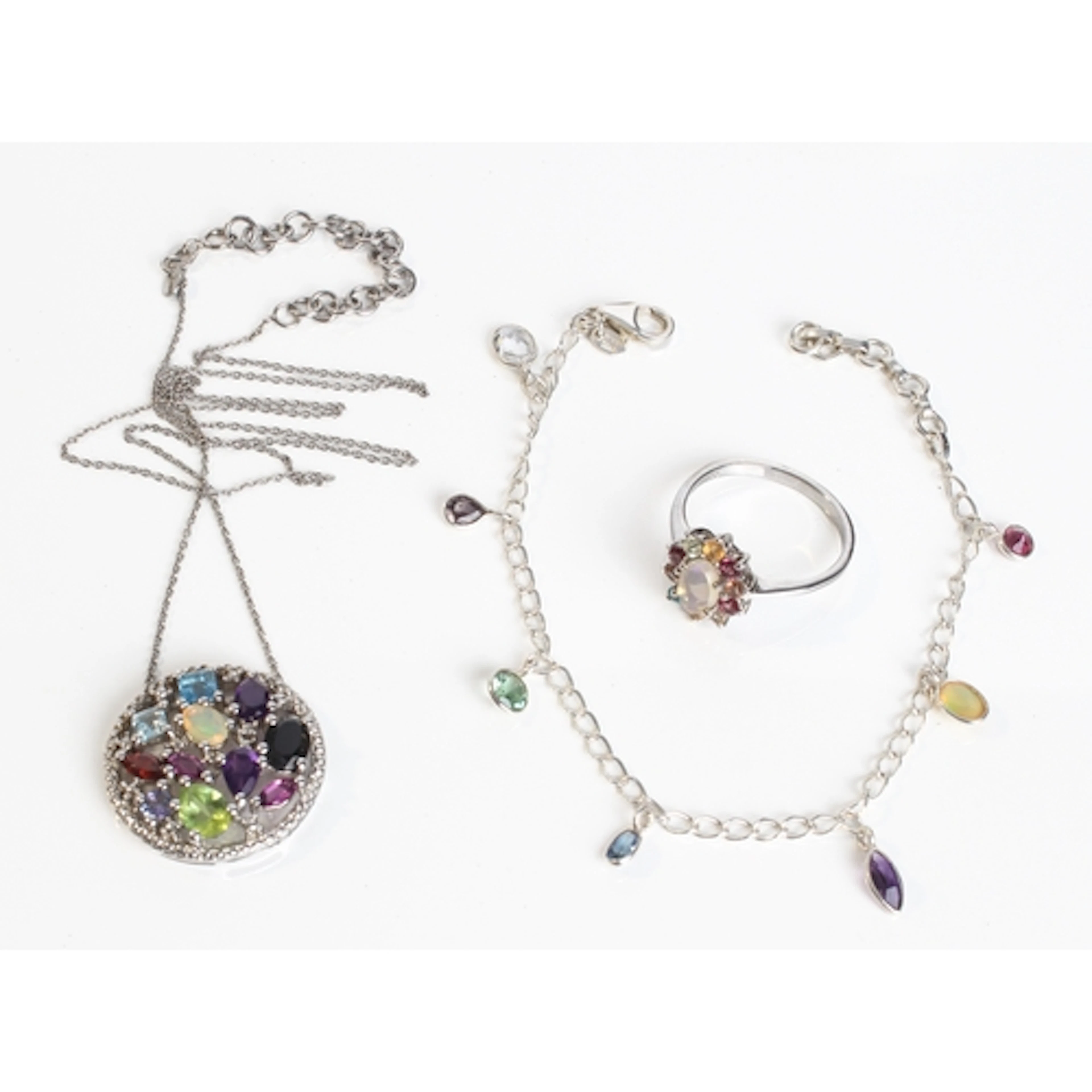 Three pieces of sterling silver and multigem jewellery - com...