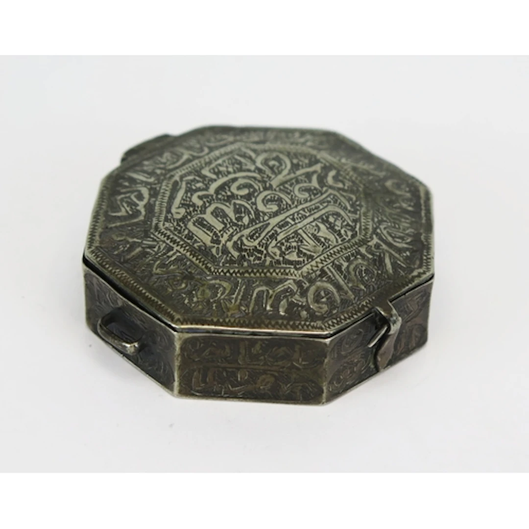 A Middle Eastern white metal miniature Quran case, of octago...