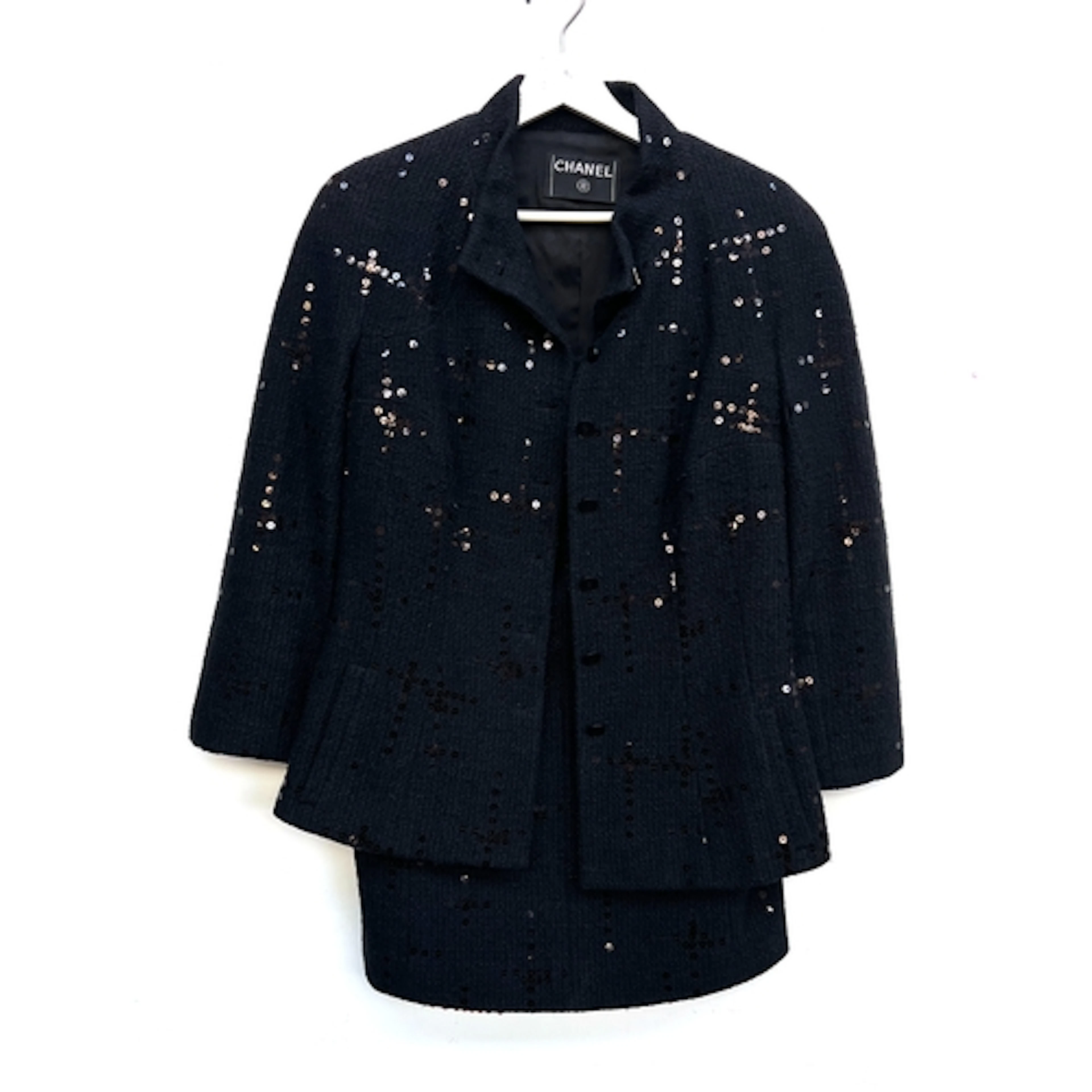 A Chanel black cotton blend jacket and matching skirt with s...
