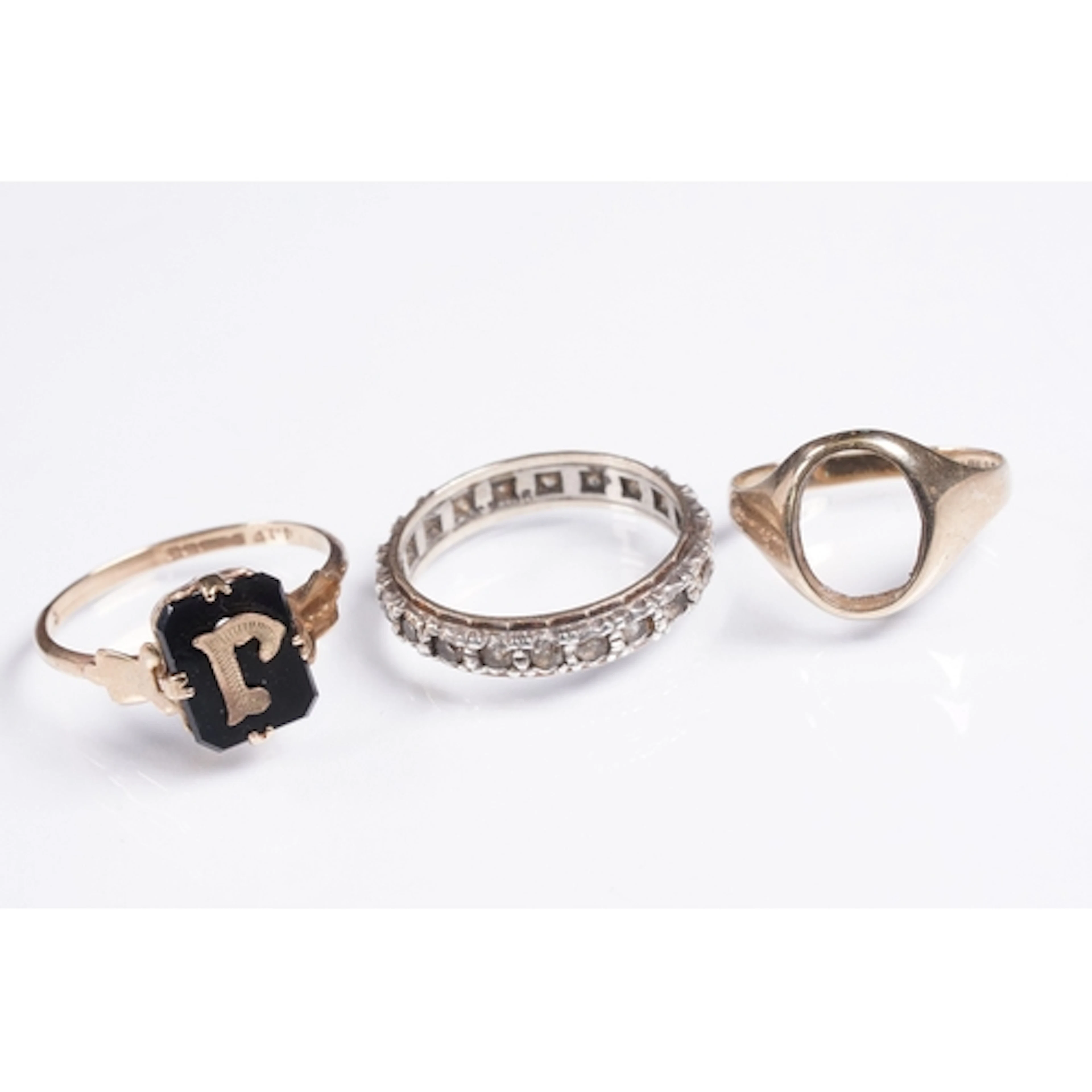 Group of three rings to include a 9ct gold and onyx 'J' init...