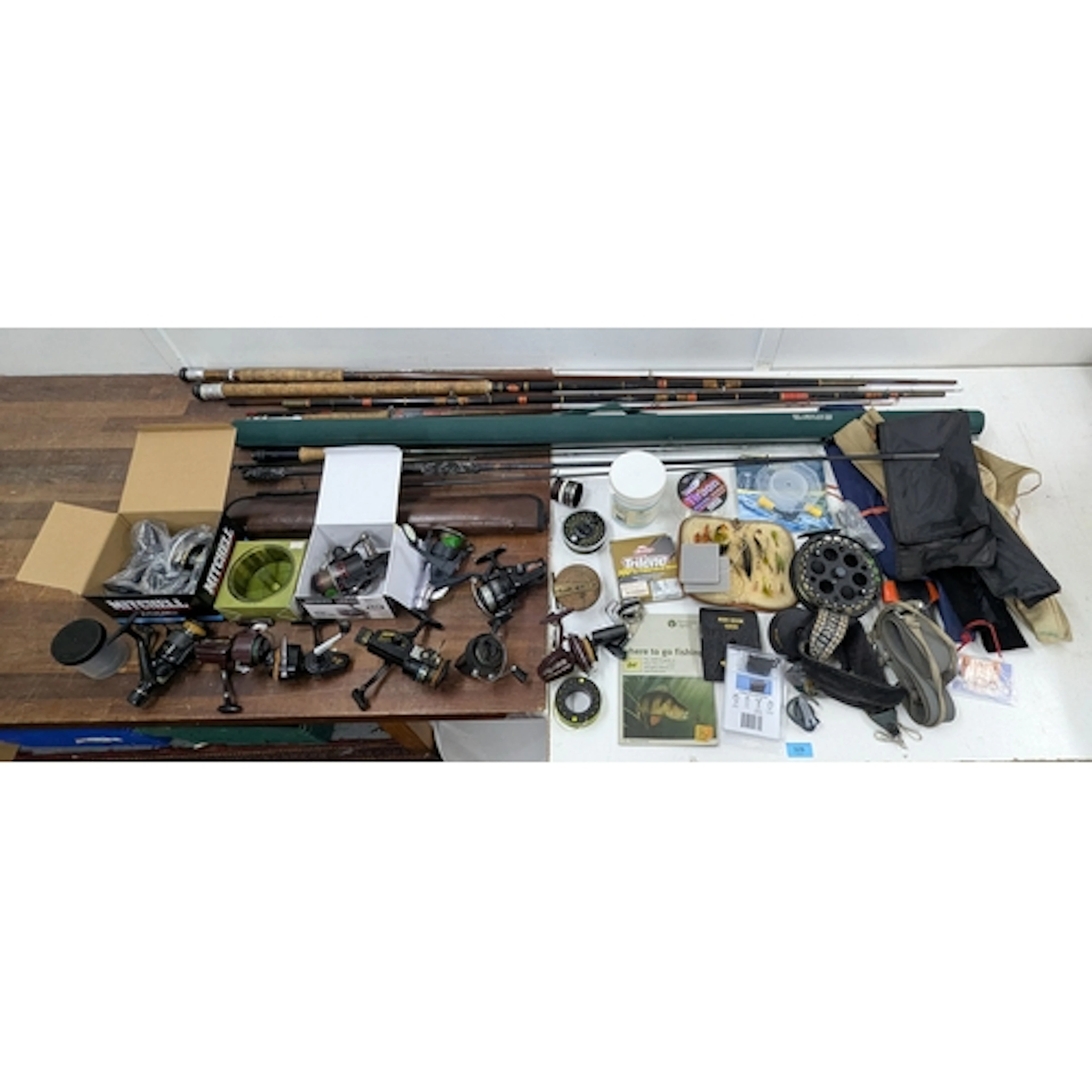 A large quantity of fishing rods and reels to include; A Sha...
