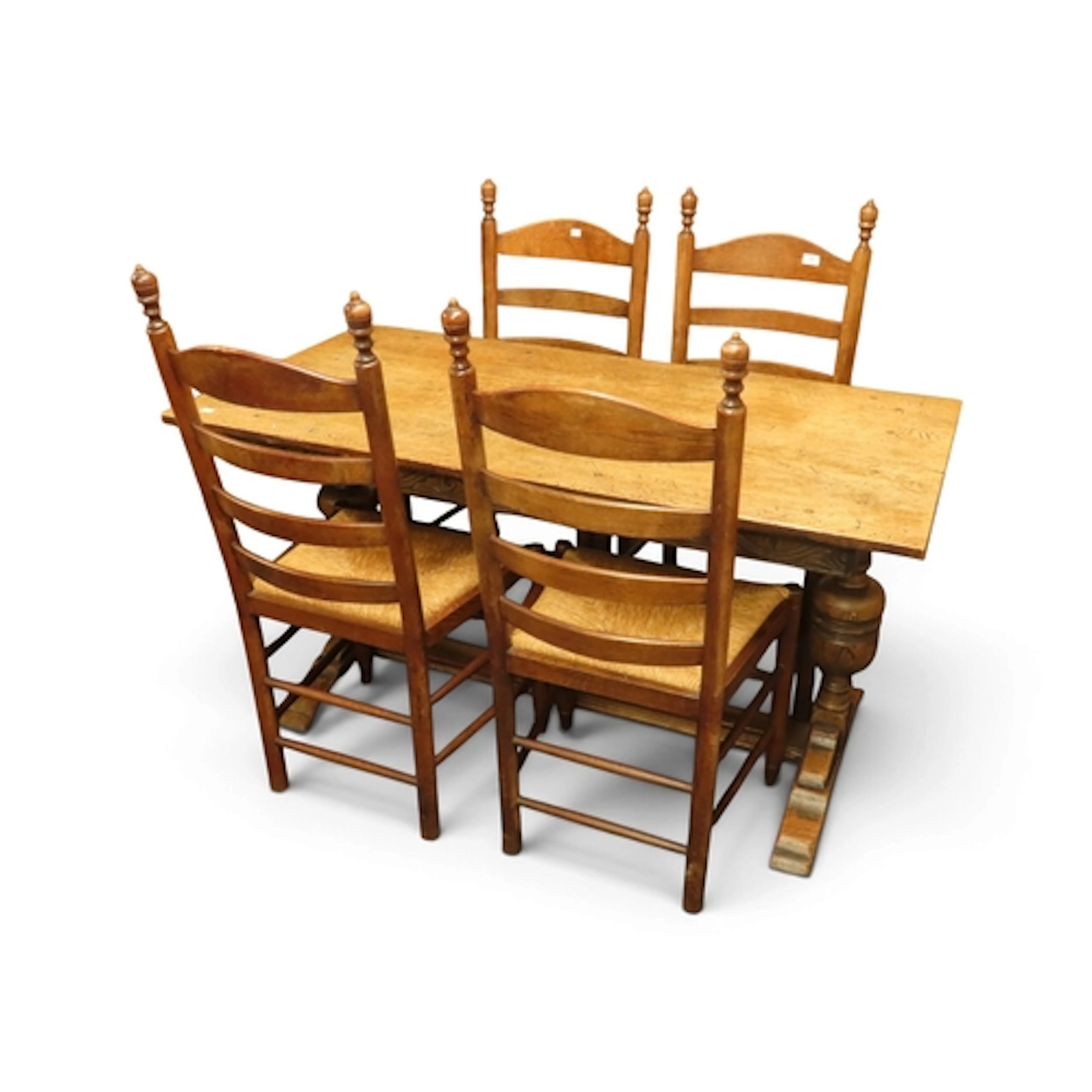 A 20th century oak Jacobean style dining table with baluster...