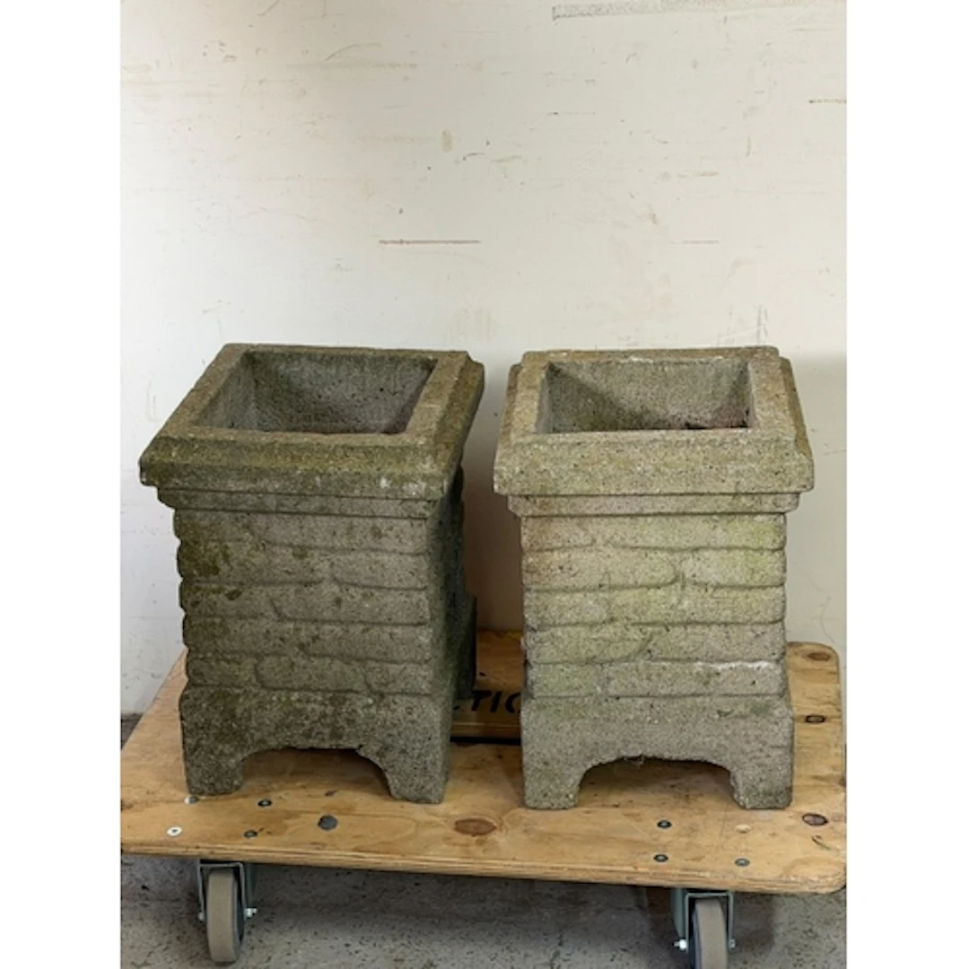 Two garden planters with brick decoration to the outside...