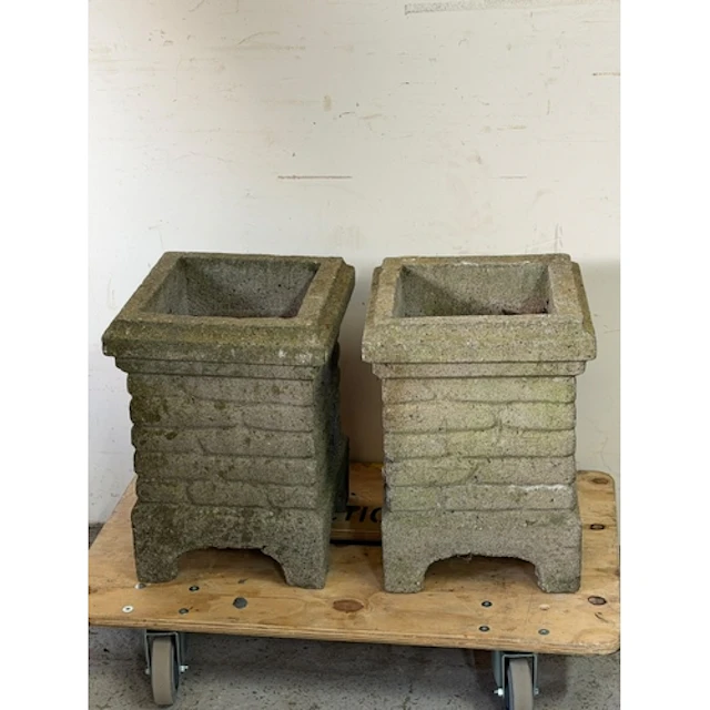 Two garden planters with brick decoration to the outside...