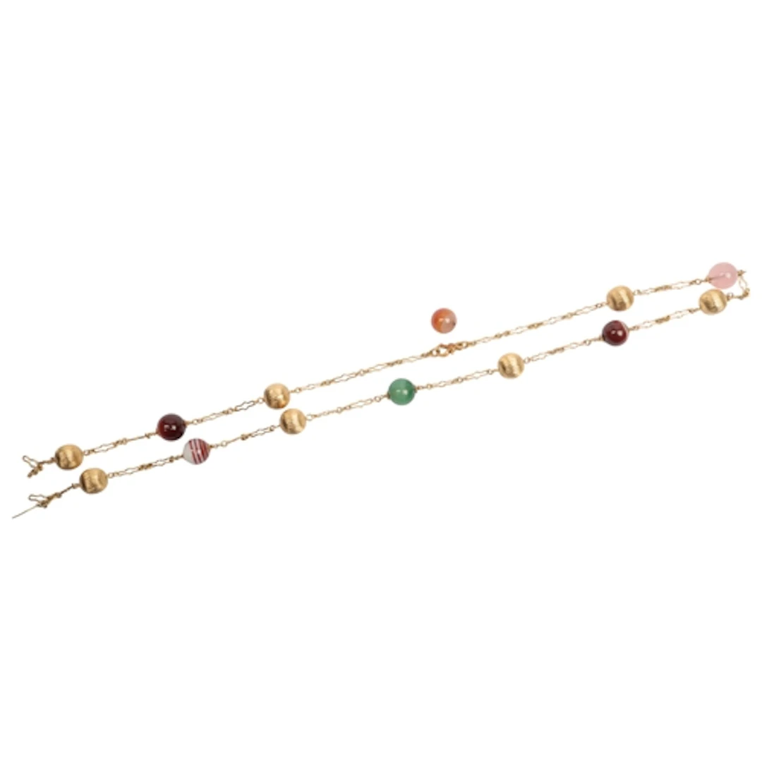A gold and hardstone necklace, composed of hardstone and flu...