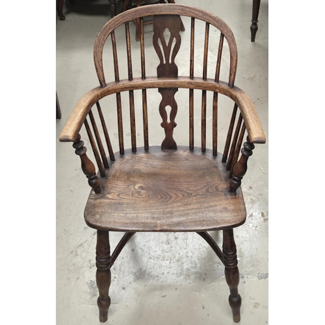 A 19th century yew and elm Windsor chair with pierced splat,...
